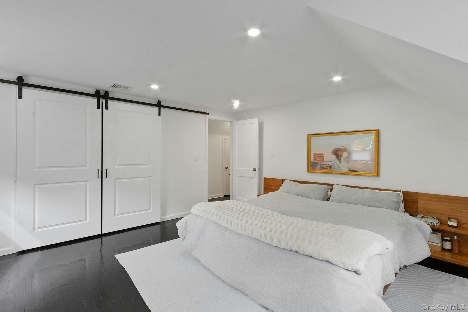 Large primary bedroom with wall to wall walk-in closet