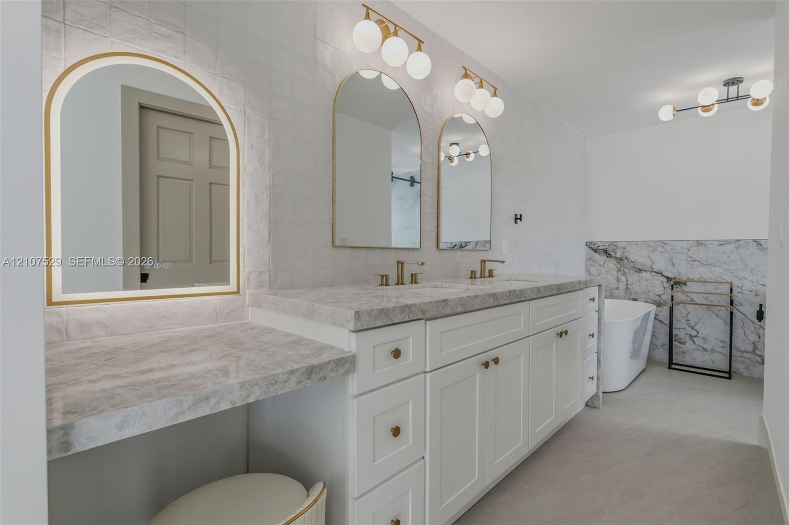 Interior space featuring large-format tile flooring, multi-panel sliding glass doors, recessed lighting, and a drum-style ceiling fixture