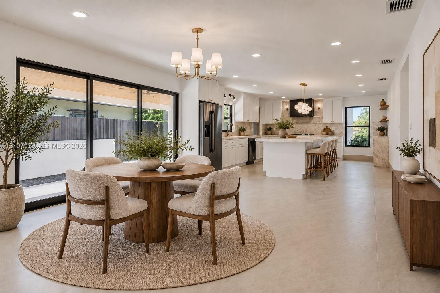 Neutral-toned tile flooring, recessed lighting, industrial-style drum ceiling fan with integrated lighting, and high-contrast window frames