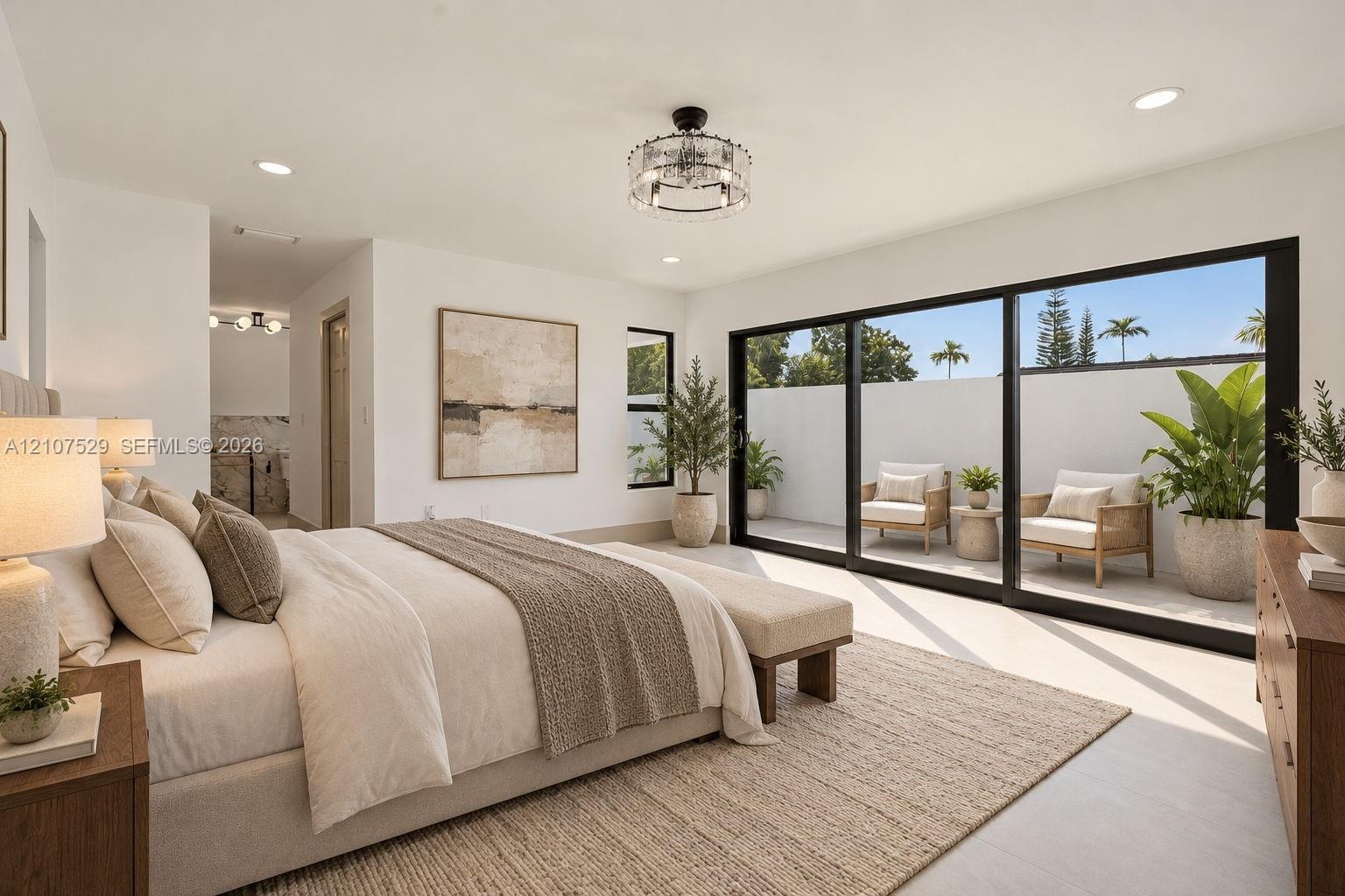 Vaulted ceilings, linear fireplace with a floor-to-ceiling surround, multi-tiered metal chandelier, full-height windows, and large-format tile floorin