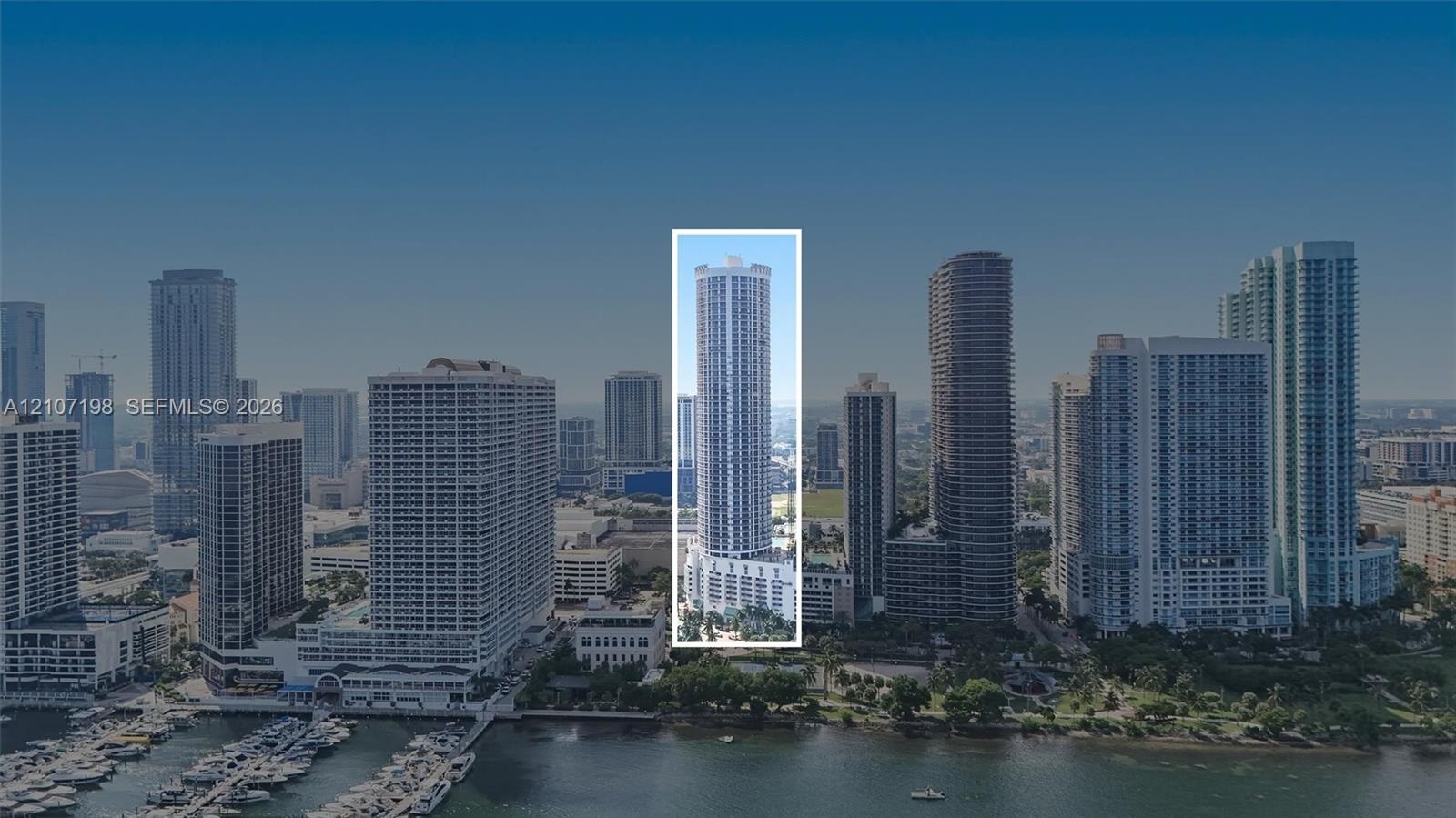 High-rise residential tower featuring a cylindrical glass facade and reinforced concrete structure