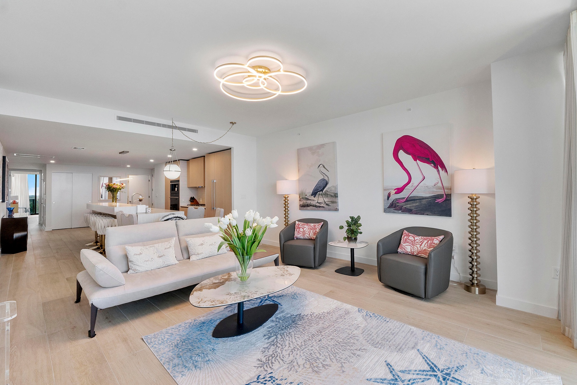 Experience refined coastal luxury in this beautifully appointed open-concept living space. Contemporary furnishings, elegant finishes, and a bright, a