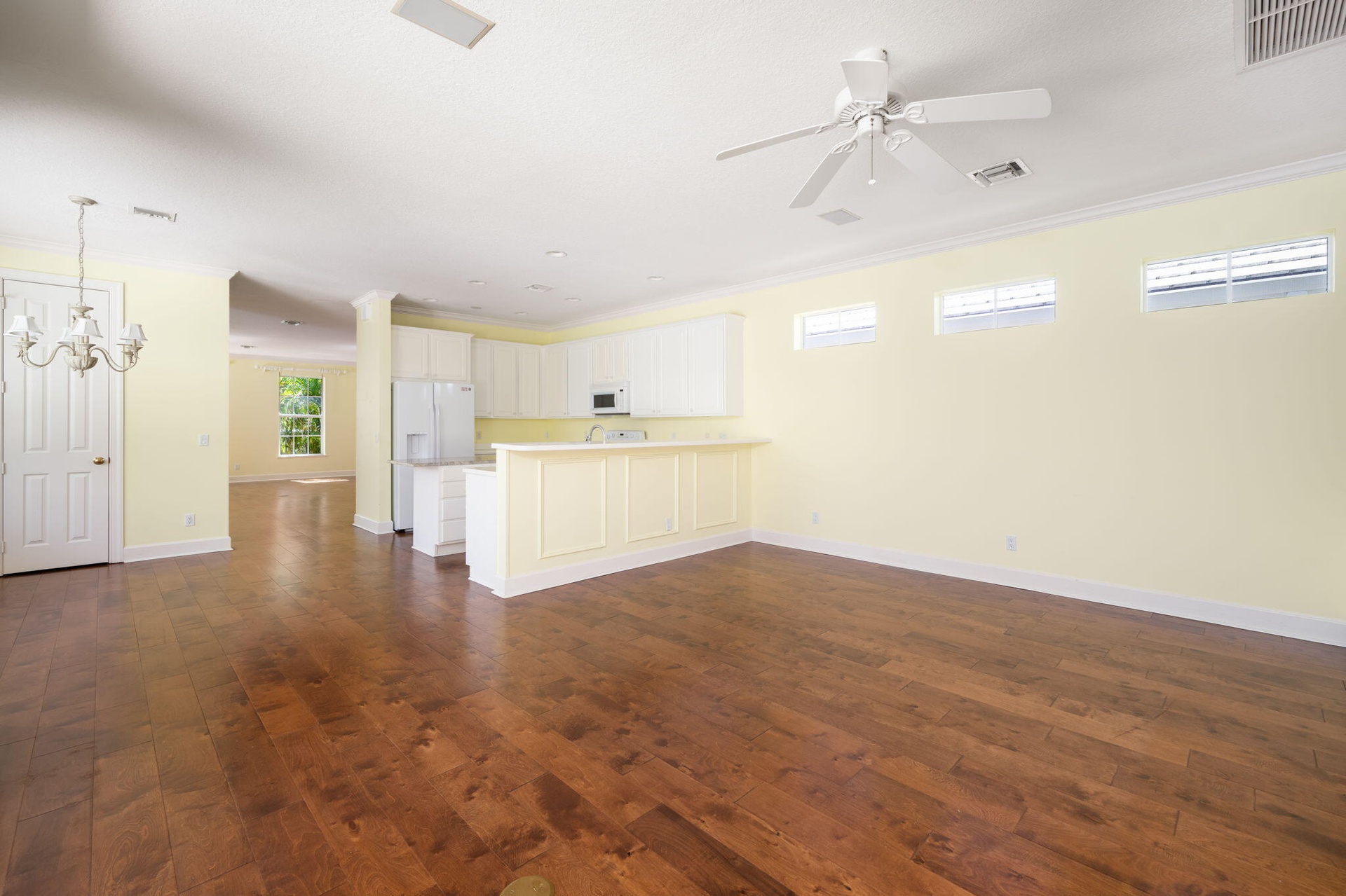 Open living in this family to kitchen light and bright spacious family room. Comes complete with custom shelves, wood floors and sliders that open ent