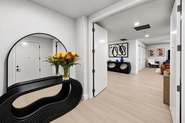 A grand entrance showcasing contemporary elegance, refined finishes, and a beautifully appointed foyer that creates an unforgettable first impression