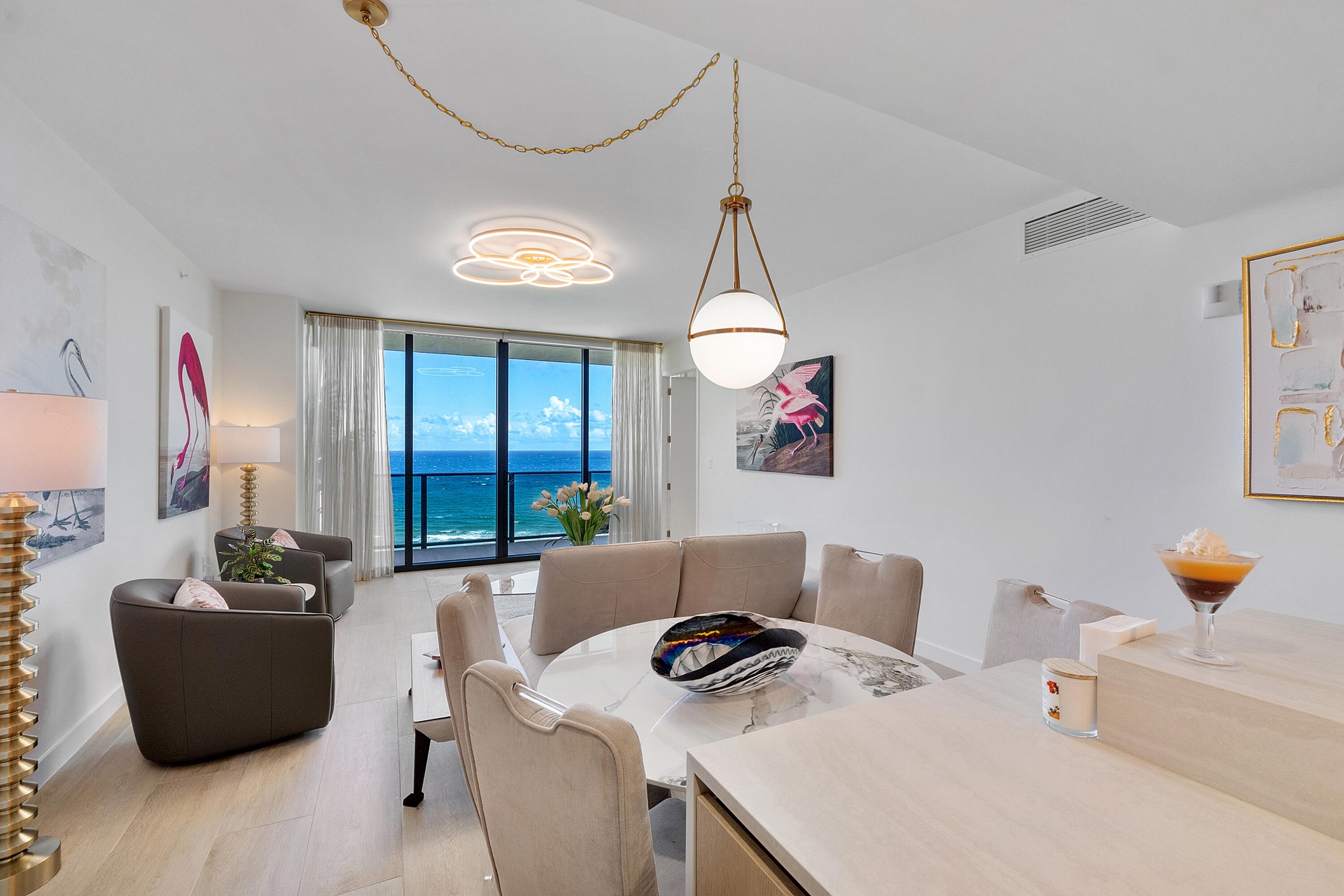 Dine in style while enjoying captivating Atlantic Ocean views. This beautifully designed dining area combines contemporary elegance with coastal sophi