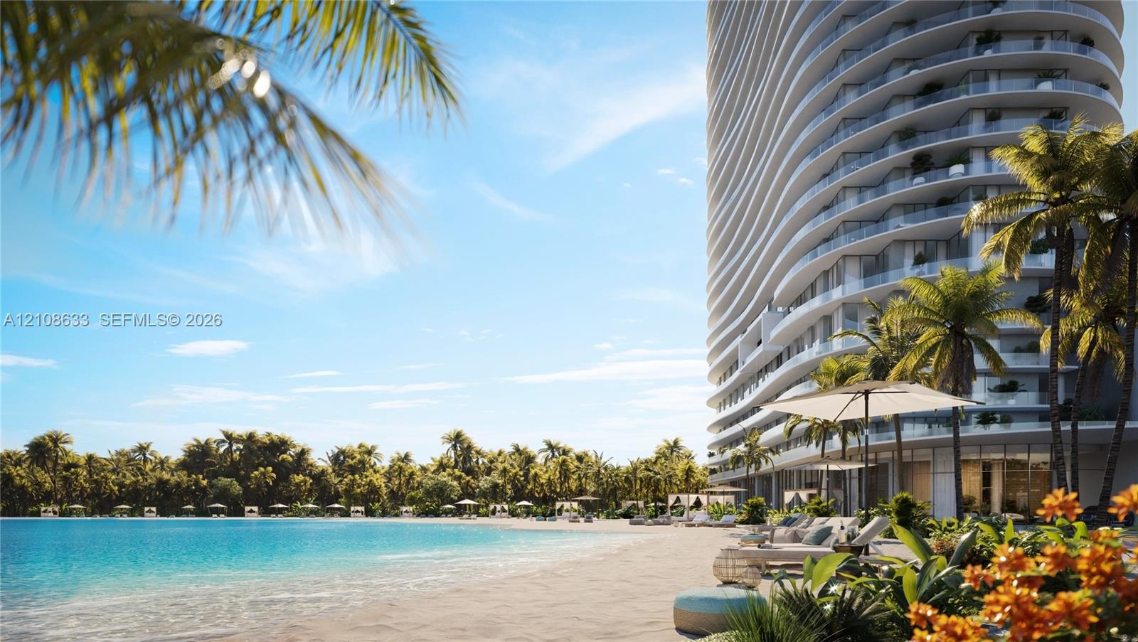 High-rise residential tower featuring curved glass balconies, situated along a private lagoon with a sandy beach and mature palm landscaping