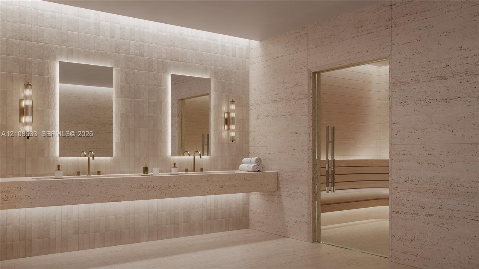 Full-width stone vanity featuring dual integrated sinks, rectangular back-lit mirrors, wall-mounted metallic fixtures, and a built-in sauna with a gla