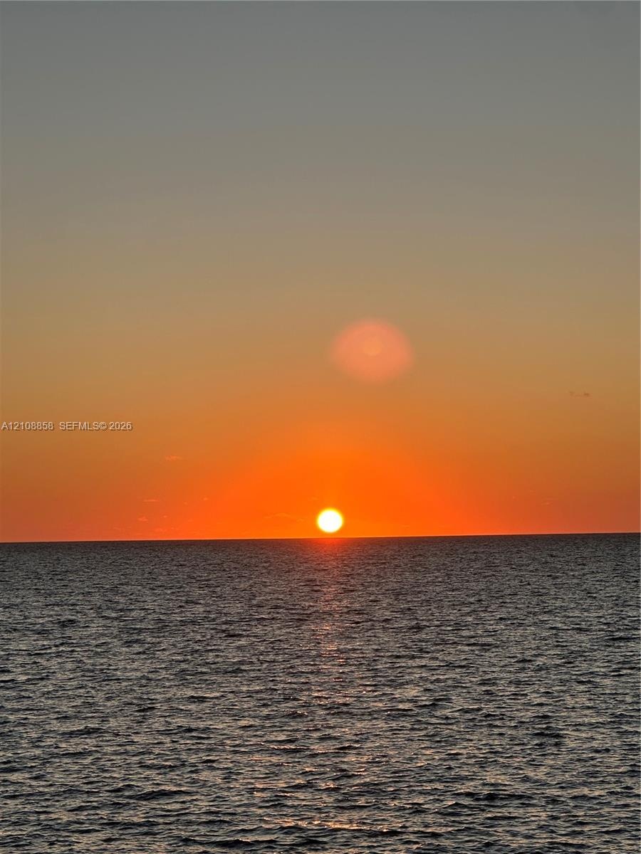 Ocean horizon featuring a prominent sunset backdrop