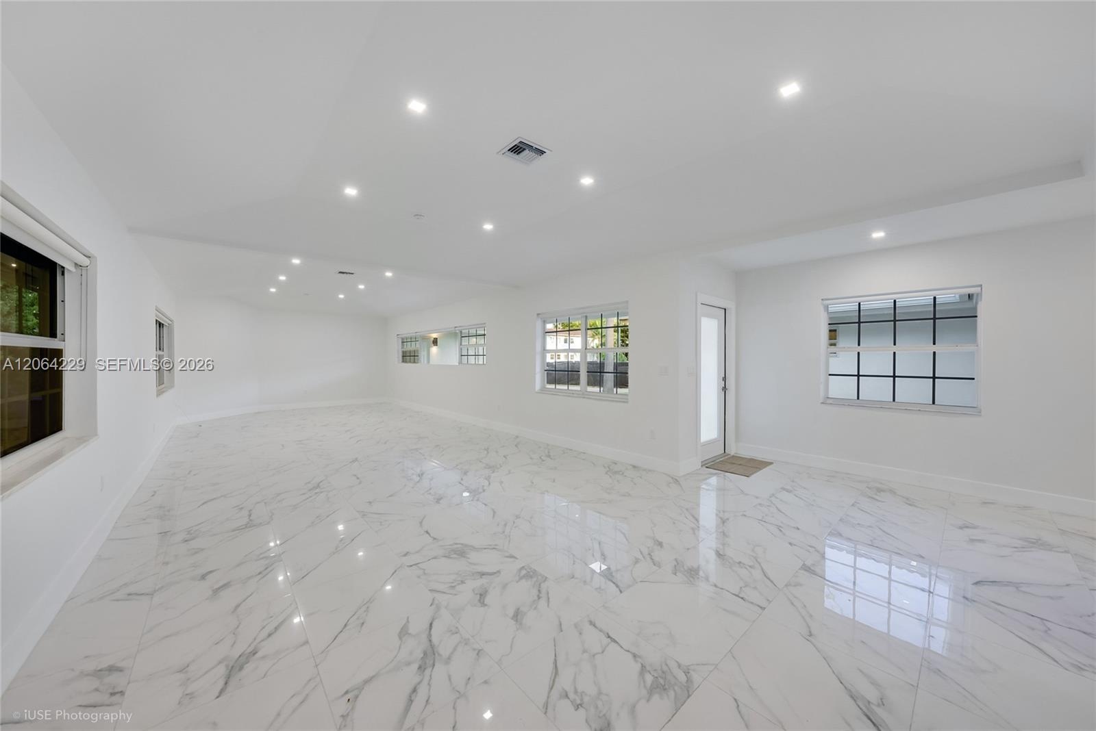Entrance Door to living room area, dinning and open kitchen