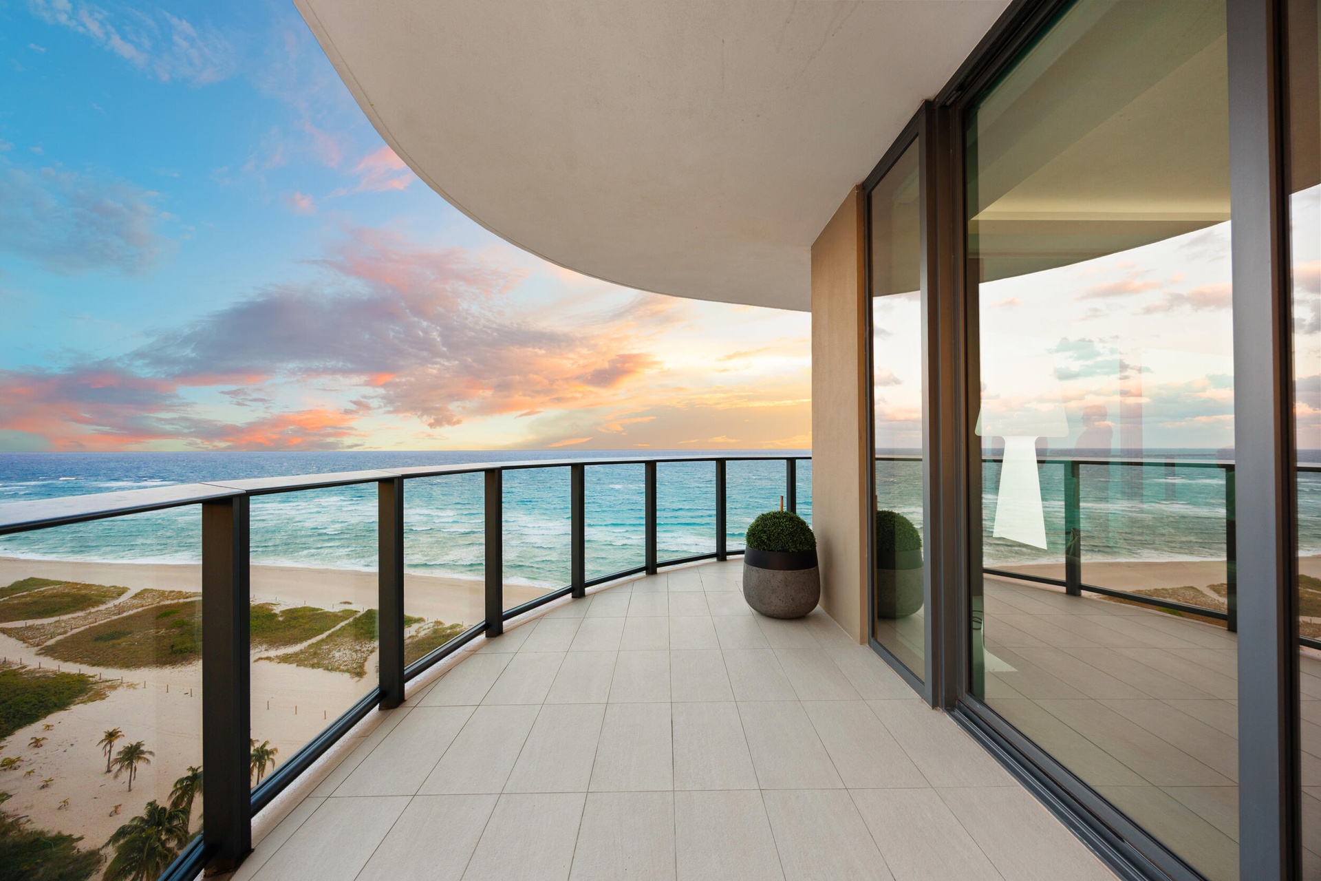 The expansive wraparound balcony offers an exceptional amount of outdoor living space and a peaceful setting to unwind with family and friends. As eve