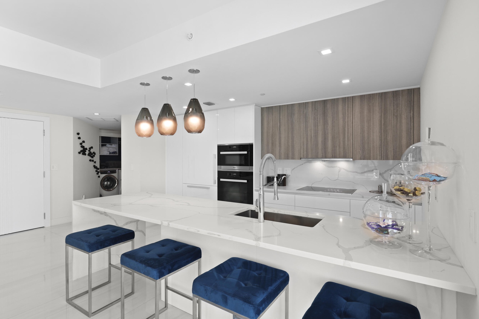 Beyond the chef's kitchen lie 2 guest bedrooms, 3 full bathrooms and a den with style that is rarely seen.