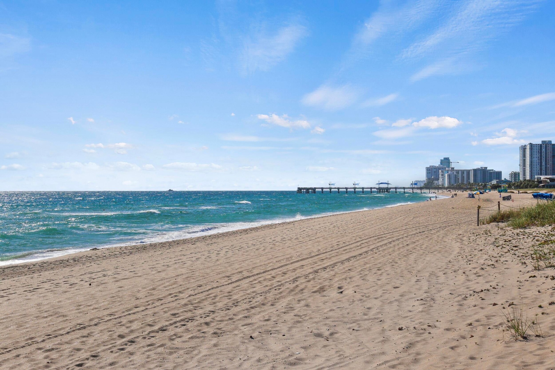 Just steps from your front door, this oceanfront residence is ideally positioned on the white sand beach between the Pompano Beach Pier and the Hillsb