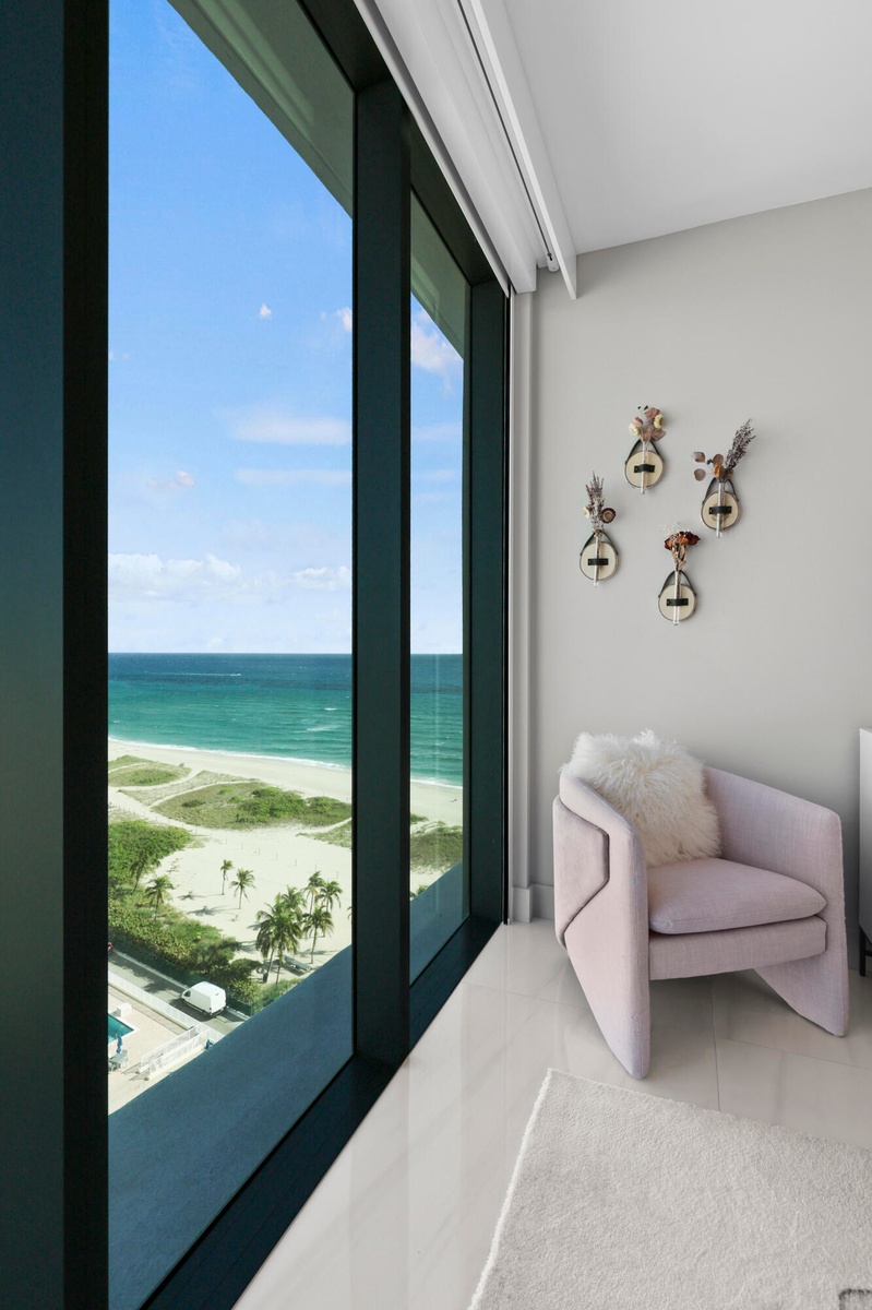 Guest bedroom 1 features more designer touches, automated shades & blinds, customized closet, and ensuite bathroom.
