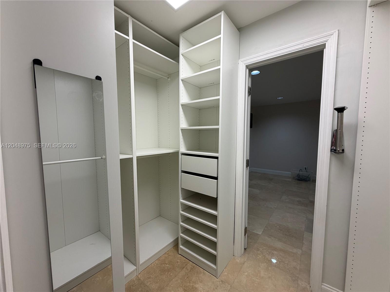 Primary Bedroom Walk-In Closet (between Primary Bathroom and Office)