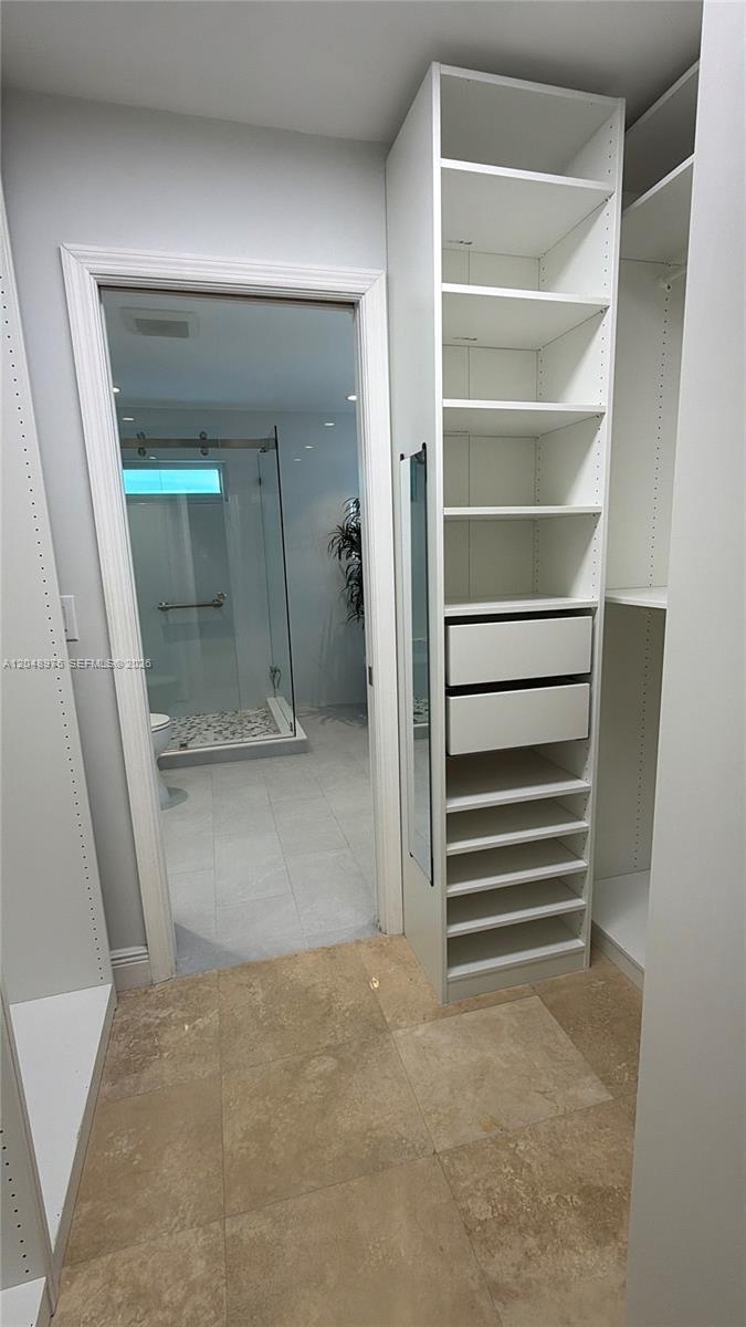 Primary Bedroom Walk-In Closet (between Primary Bathroom and Office)