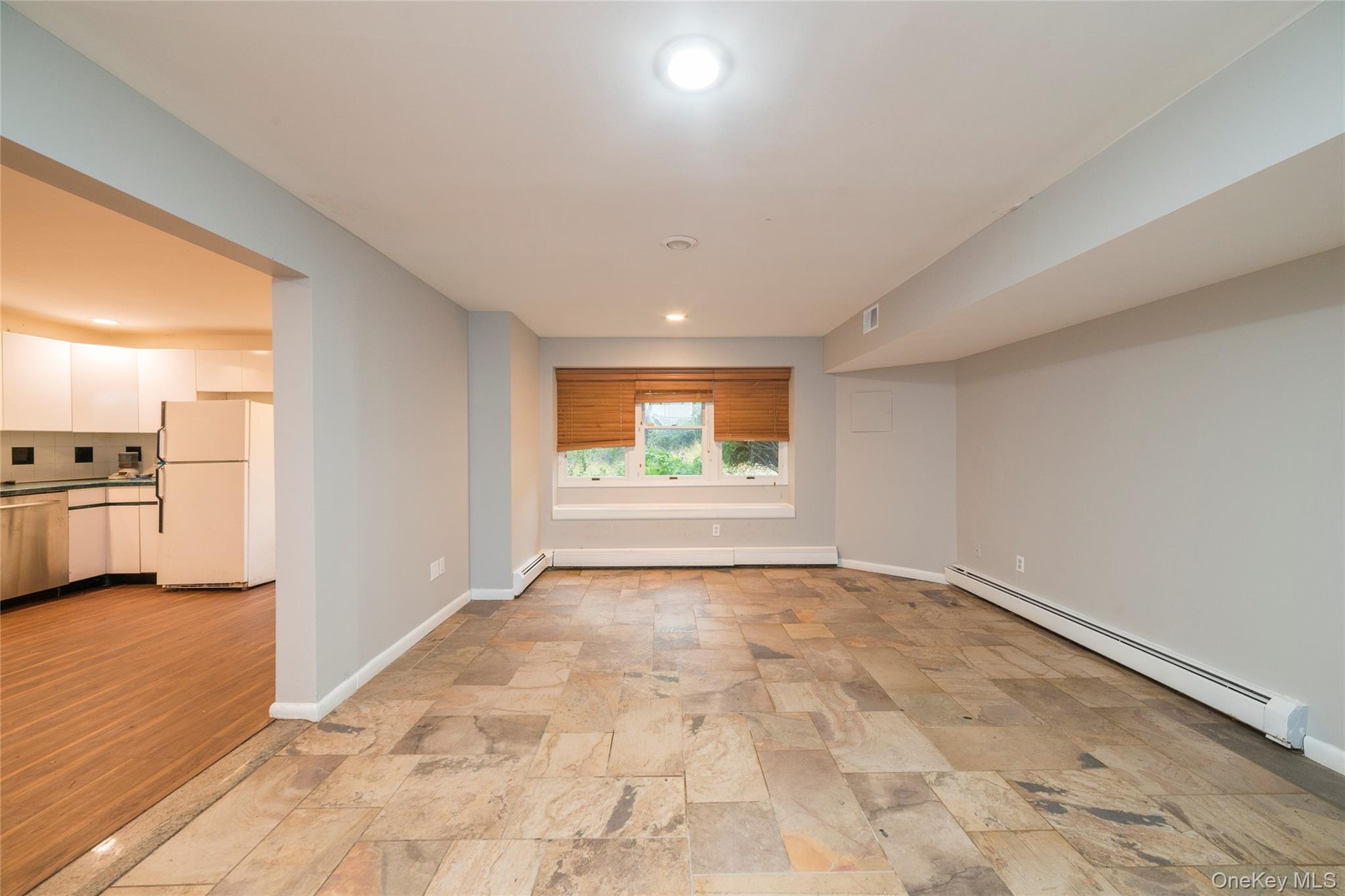 This room can be used as an additional bedroom w/closet or dining room for lower level