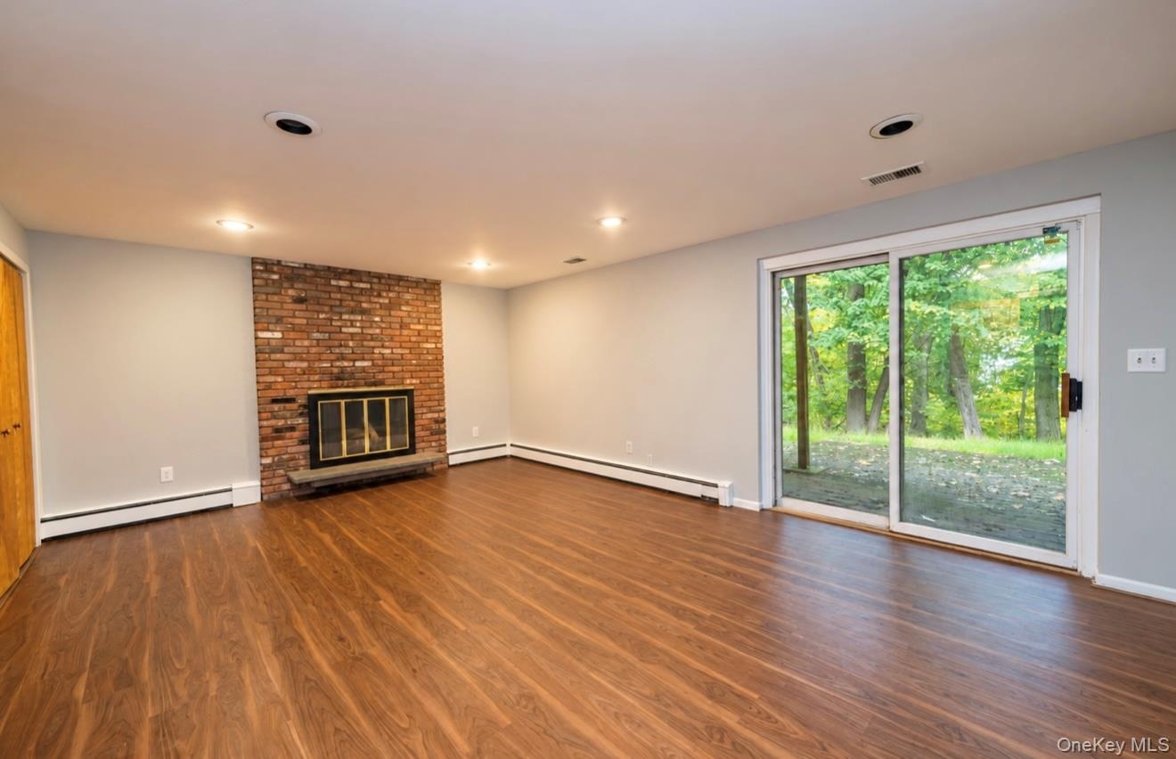 Lower Level Living Room with sliding glass doors leading out to patio