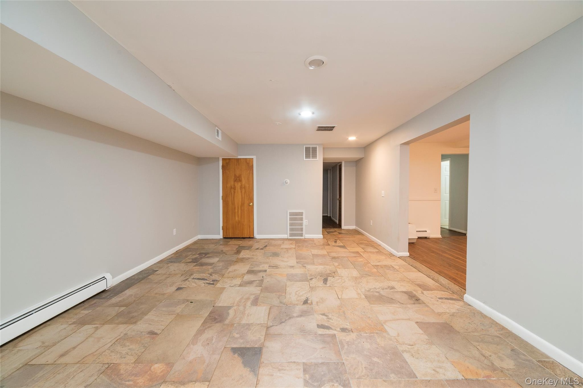 This room can be used as an additional bedroom w/closet or dining room for lower level