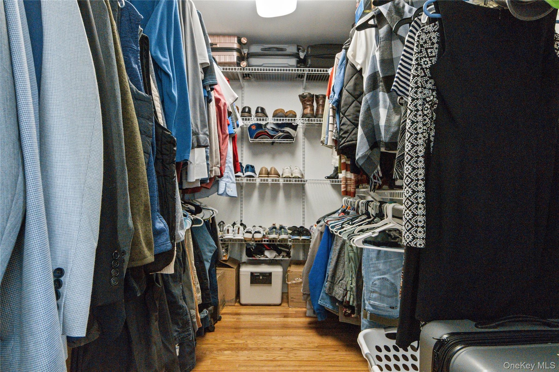 Primary Walk in closet with built ins for organization