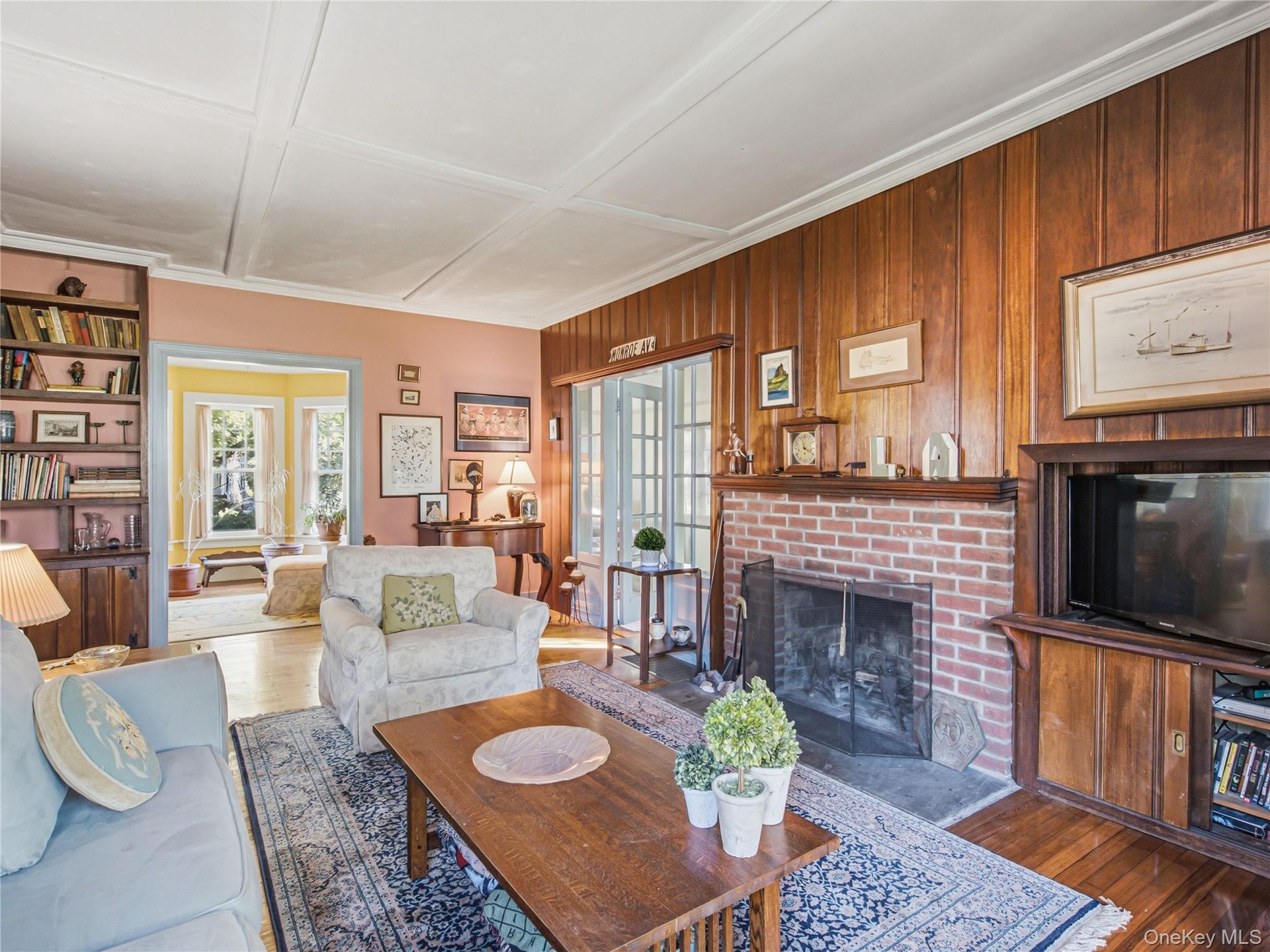 Main living room with woodburning fireplace