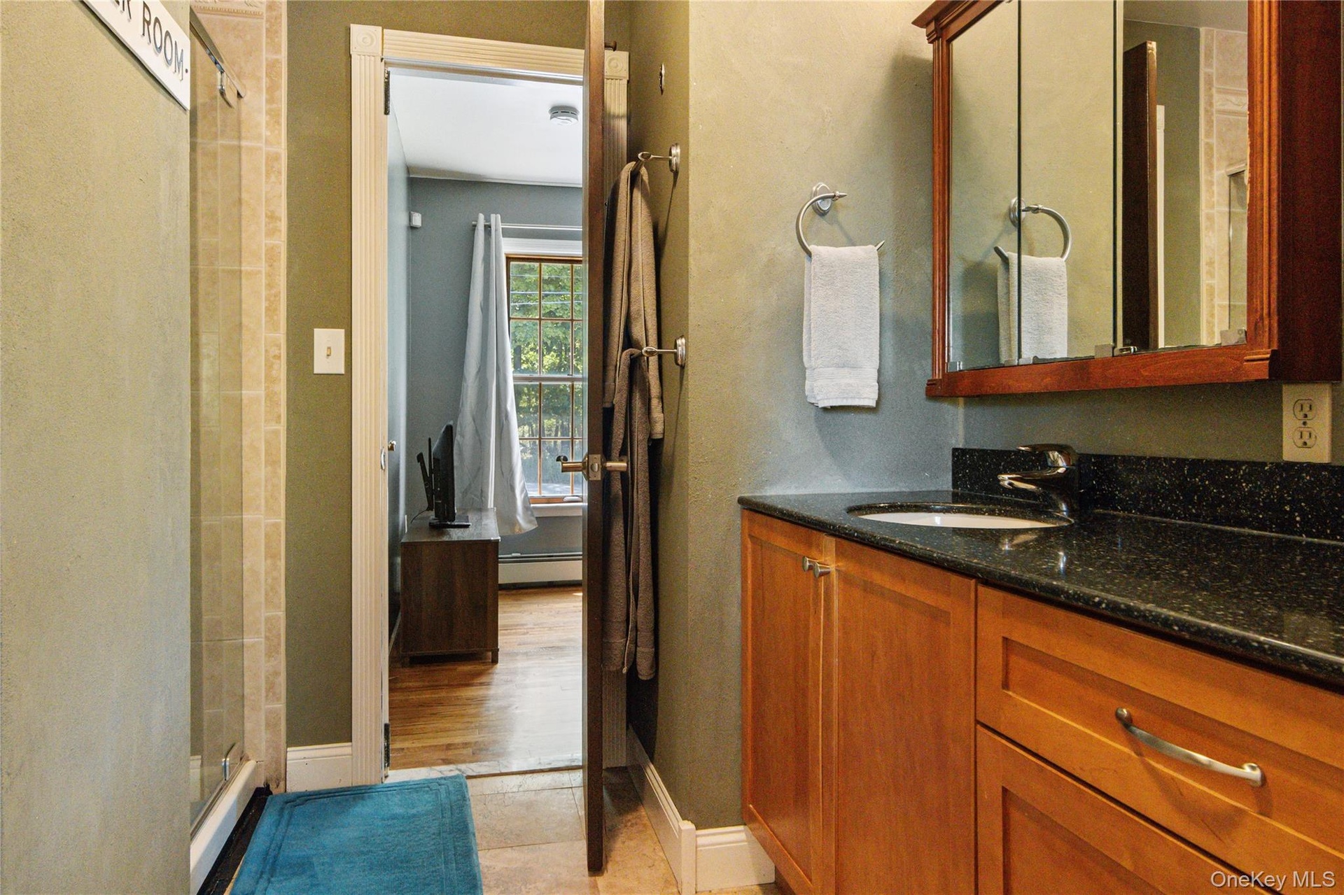 Full bath on first floor with double entry from the family room as well as 1st floor bedroom