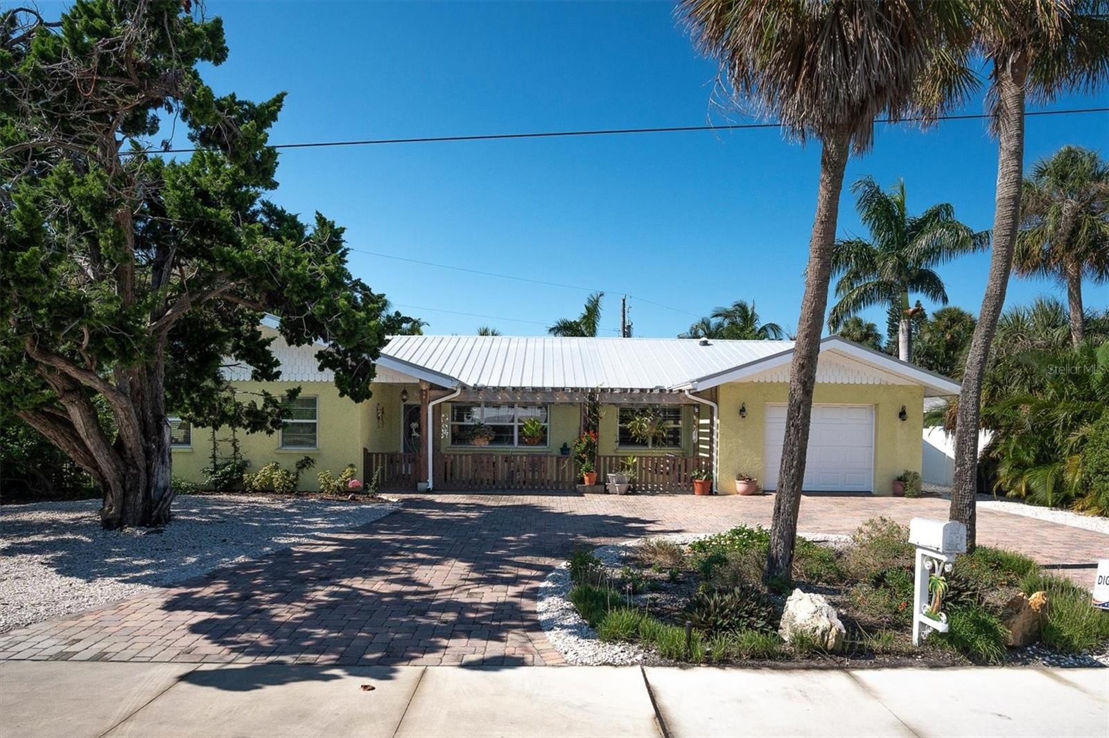 Plenty of parking space plus 1 car garage and a golf cart garage