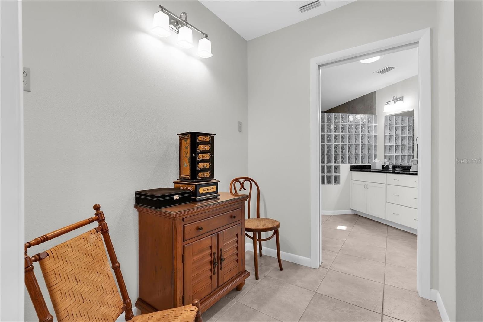 Bonus area by walk-in closet, partial view of Sola Tube skylight in the bathroom
