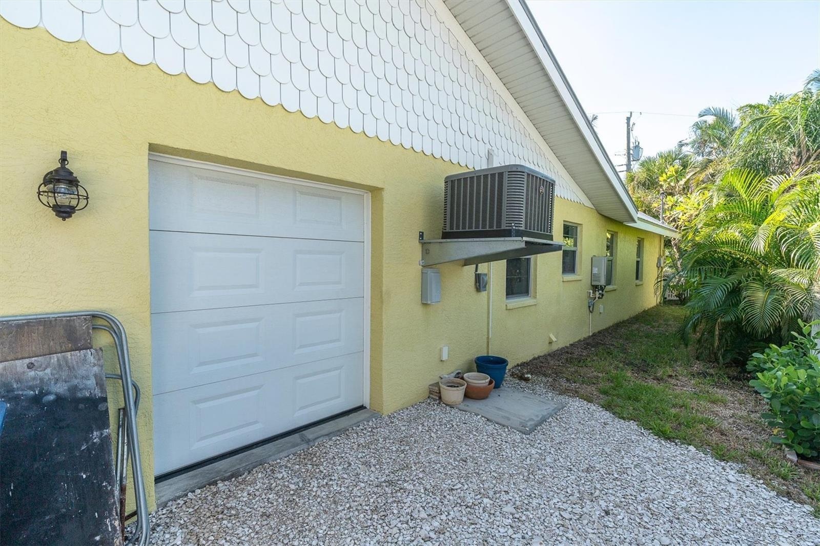 Golf cart garage. On demand hot water heater new 7/25.
