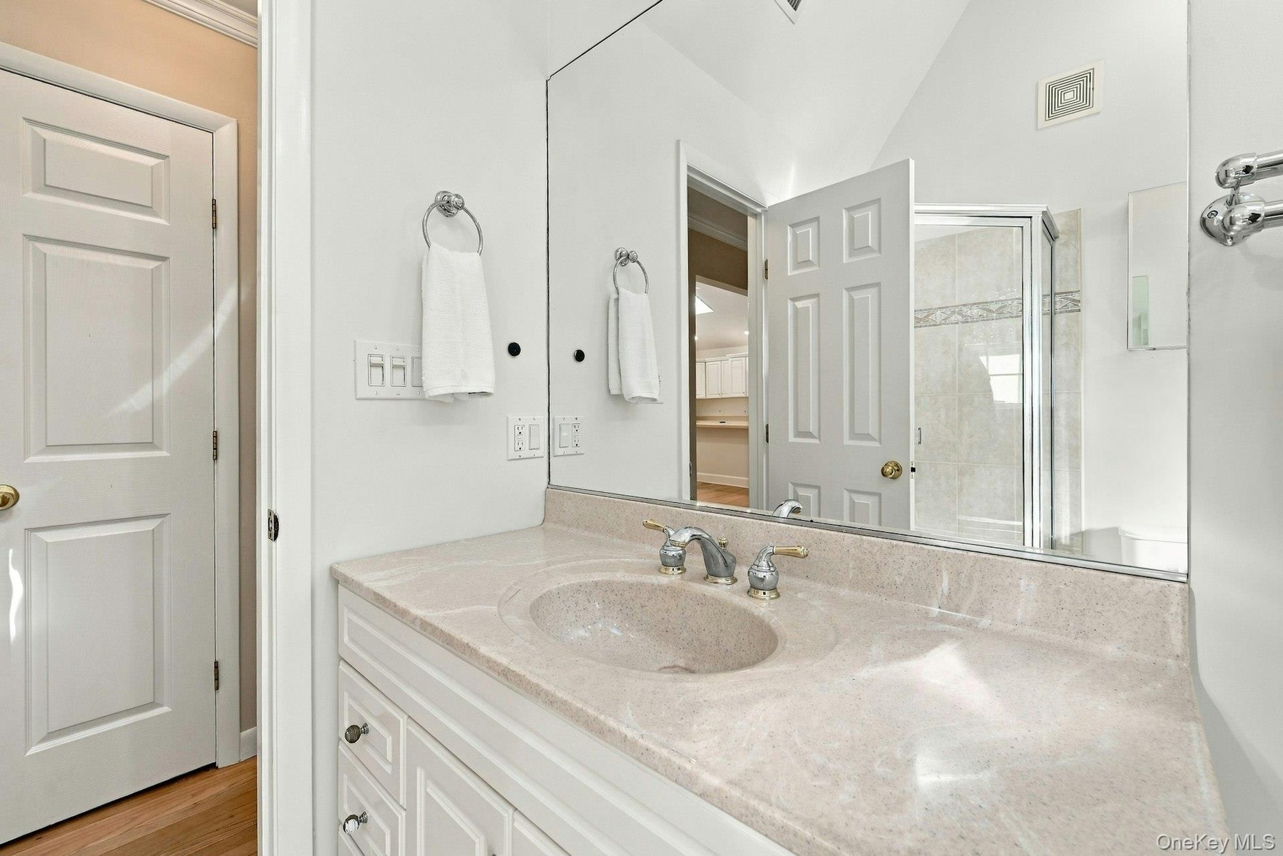 Vaulted ceilings and skylight make for a bright bathroom.