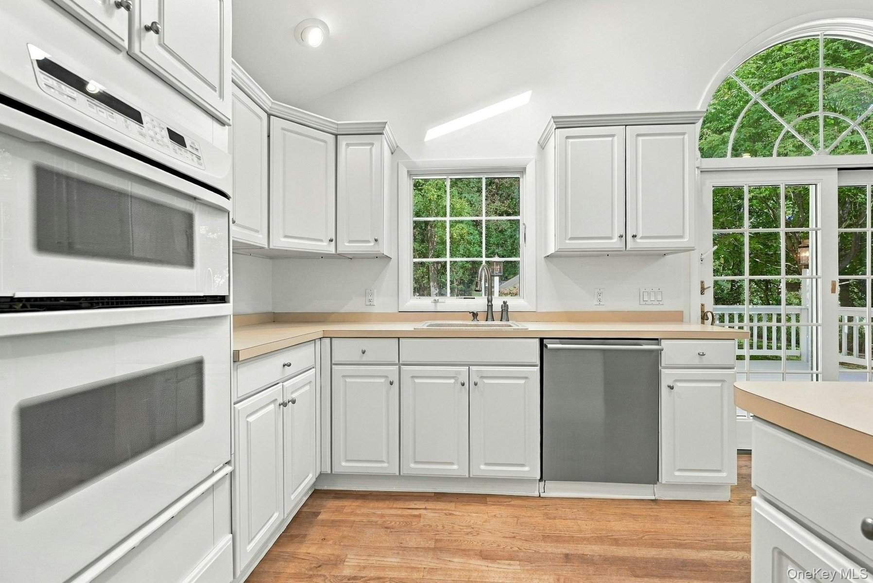 Gas wall oven and built-in microwave.