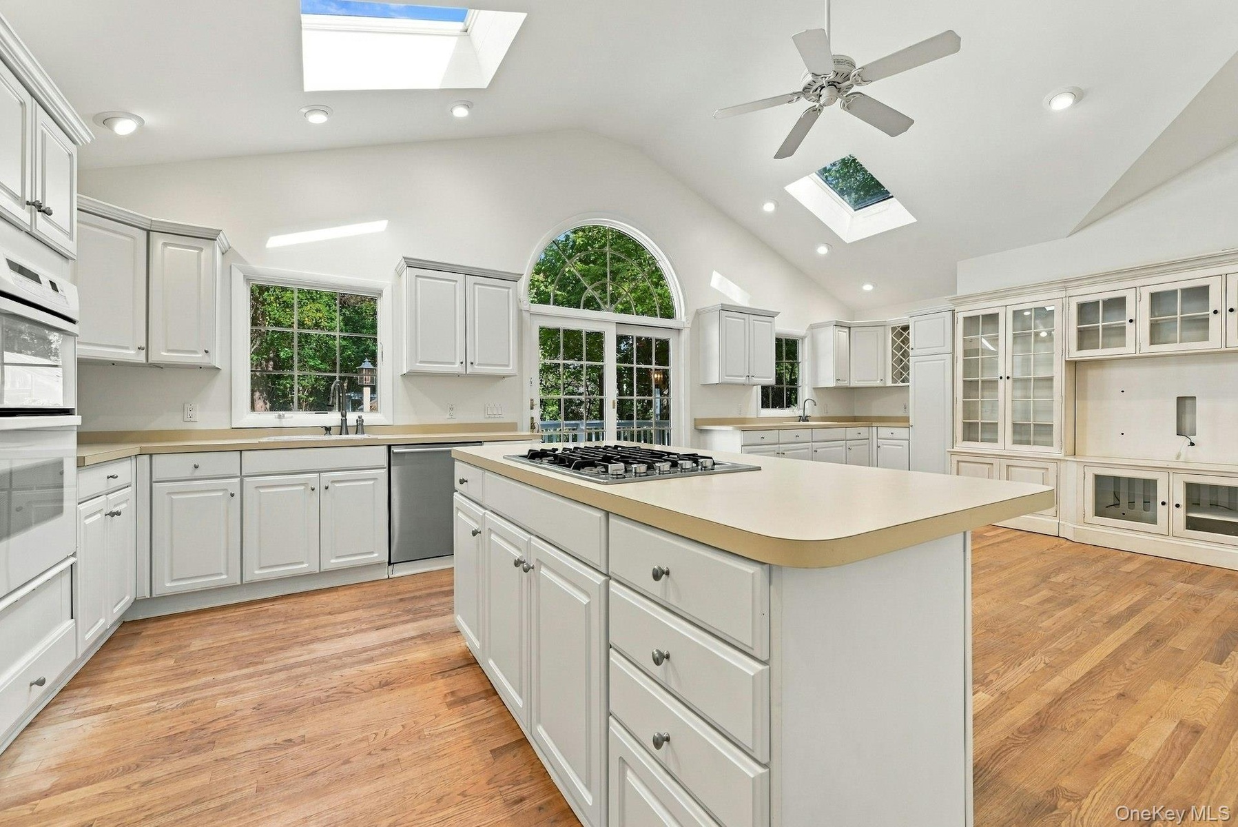 Center island with vented gas stovetop.