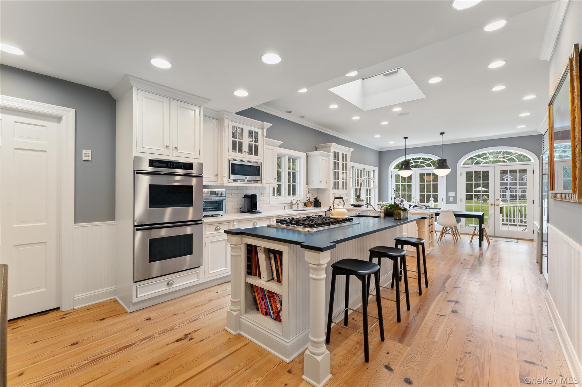 Chefs kitchen, high ceiling, French doors to expansive deck and property