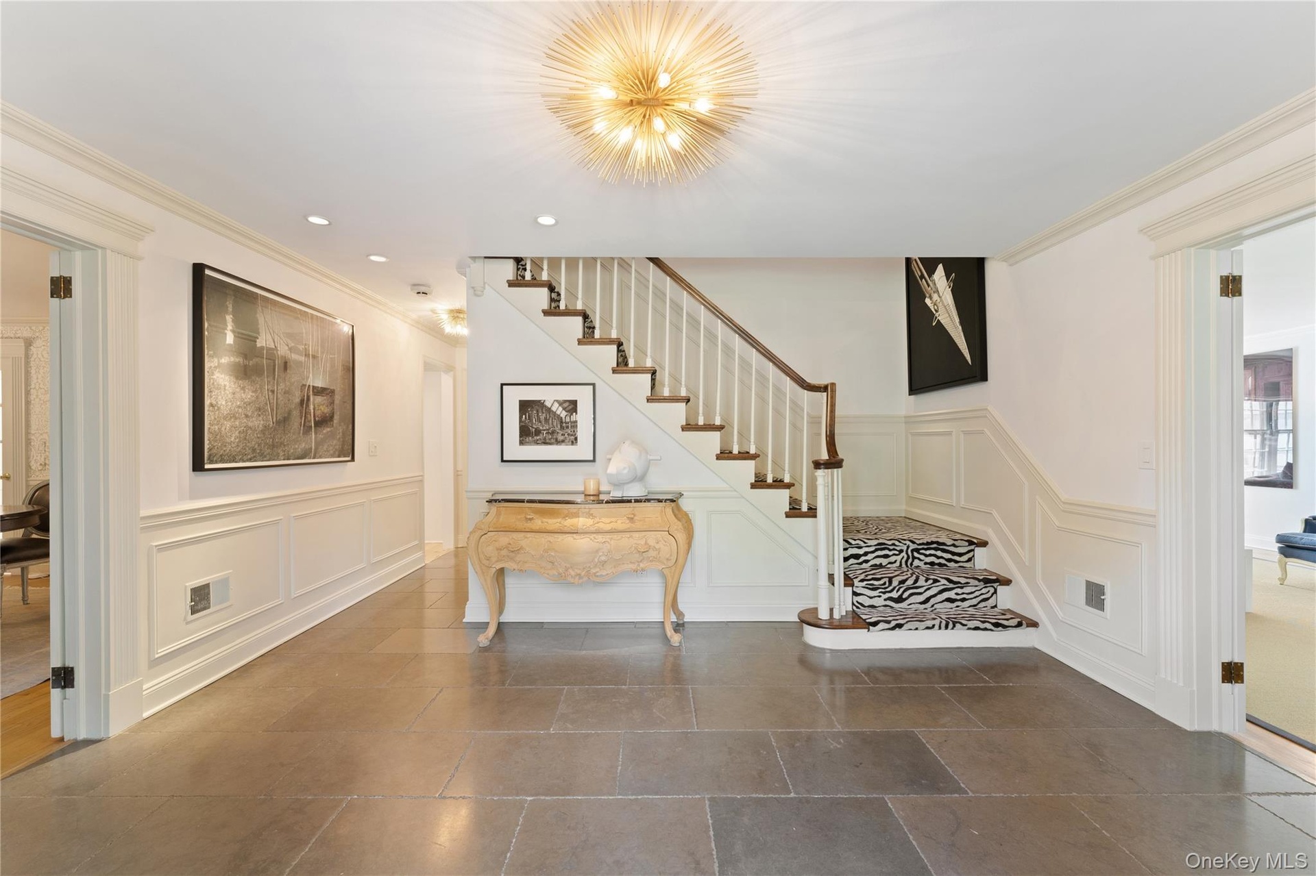 Generous in size, Belgian bluestone floor with a rich patina and tumbled edges.