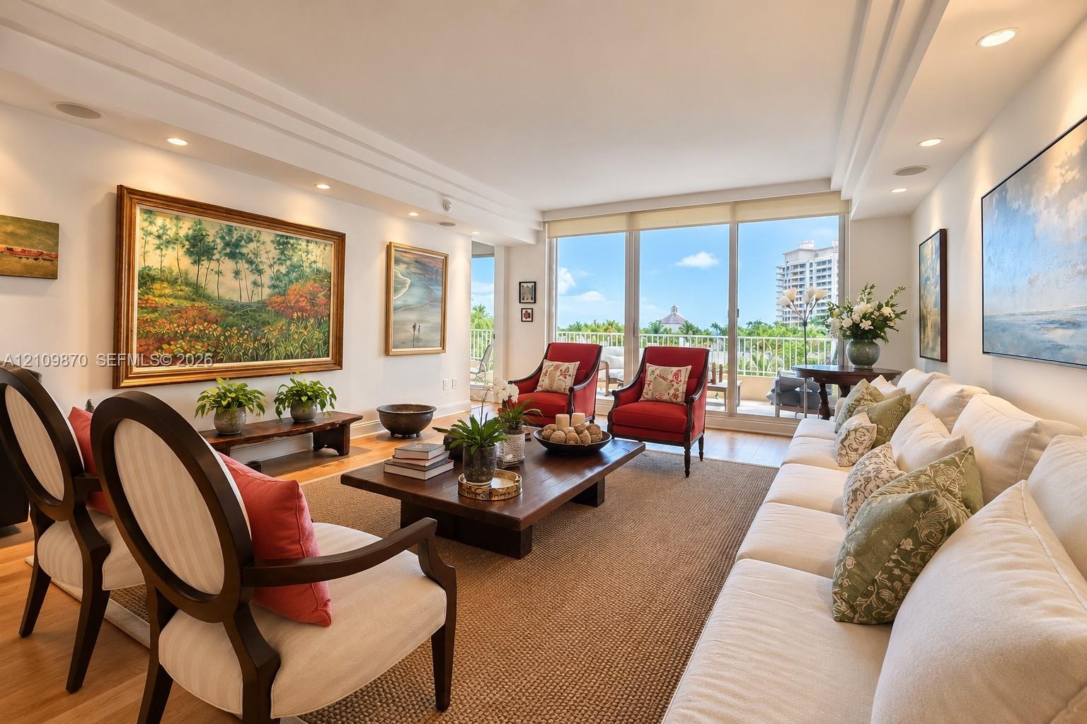 Living area featuring floor-to-ceiling glass, recessed lighting, crown molding, wood-finish flooring, and a sliding door to the exterior