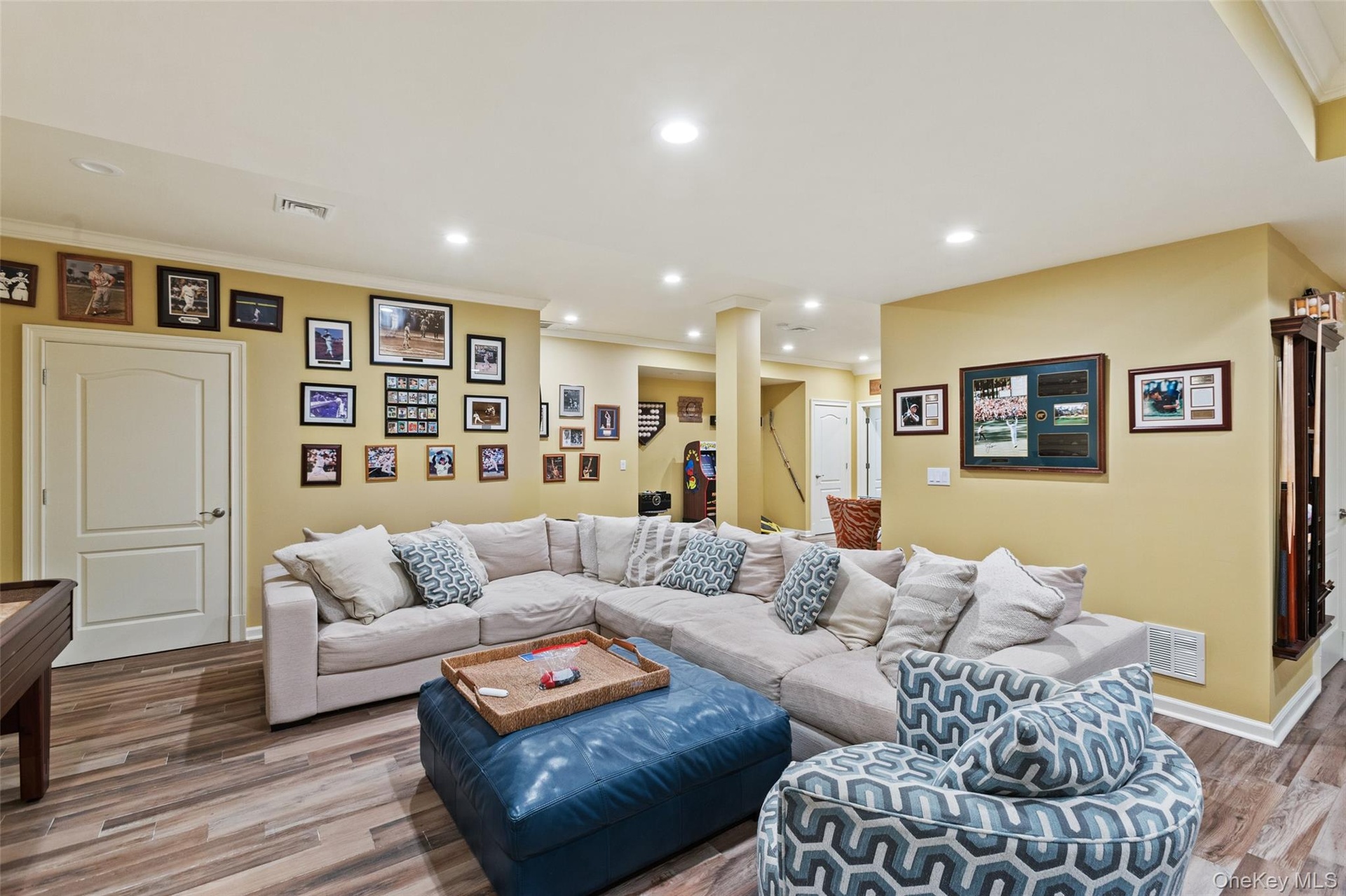 featuring recessed lighting, wood finished floors, crown molding, and baseboards