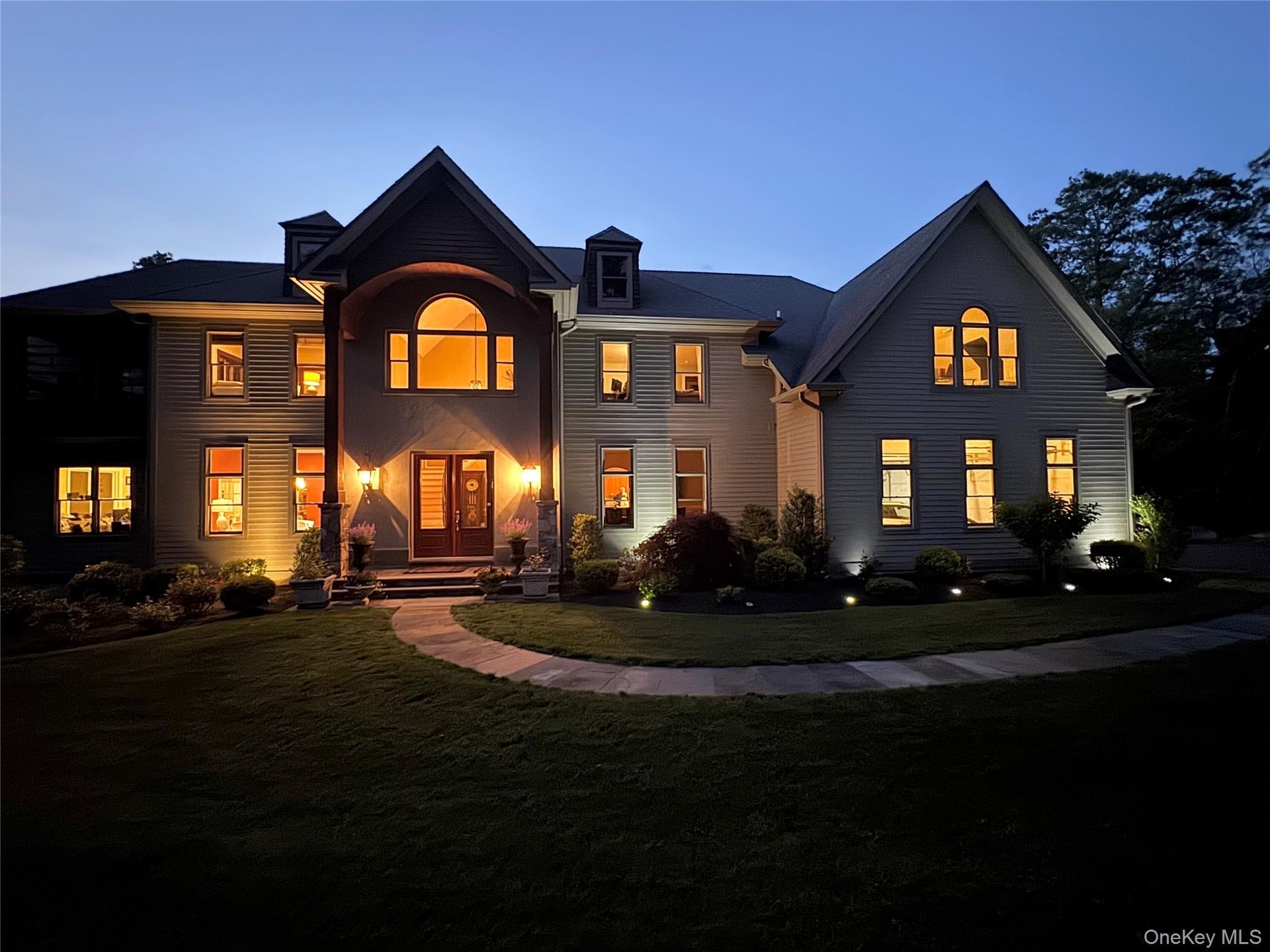 View of front of property featuring a nighttime view