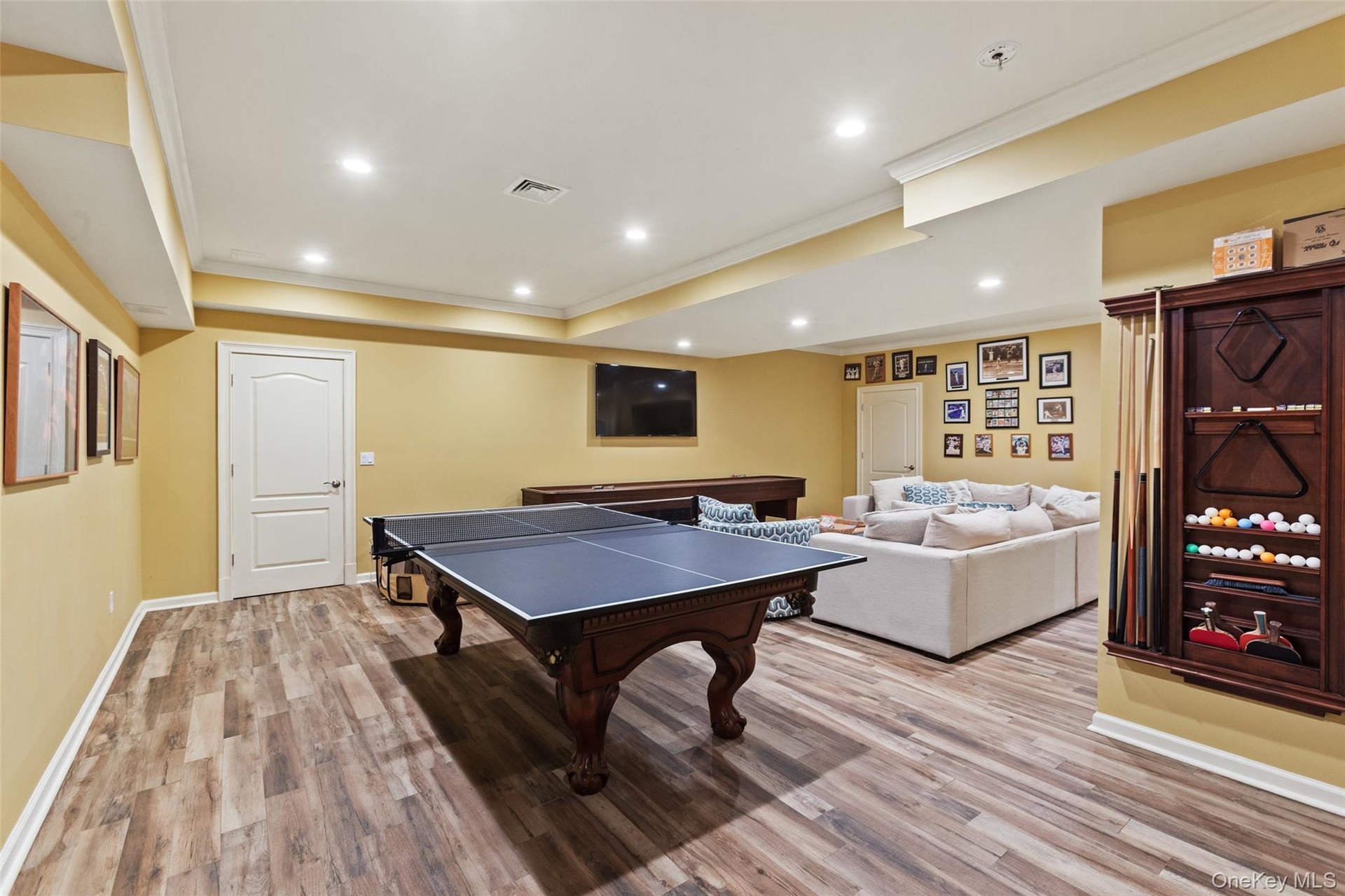 Rec room featuring crown molding, light wood finished floors, baseboards, recessed lighting, and ping pong/billiards table