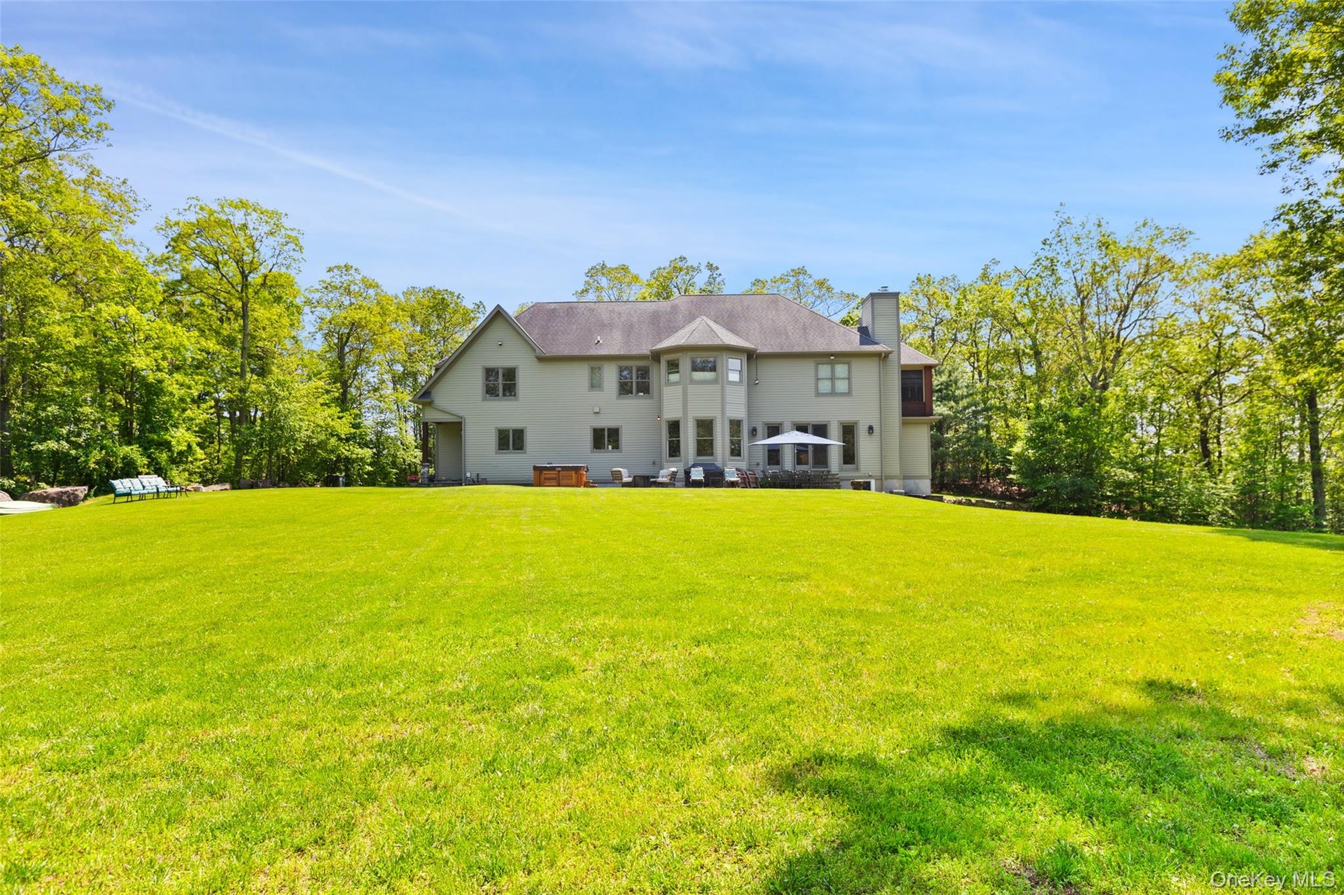 Back of property featuring 3.47 level acres