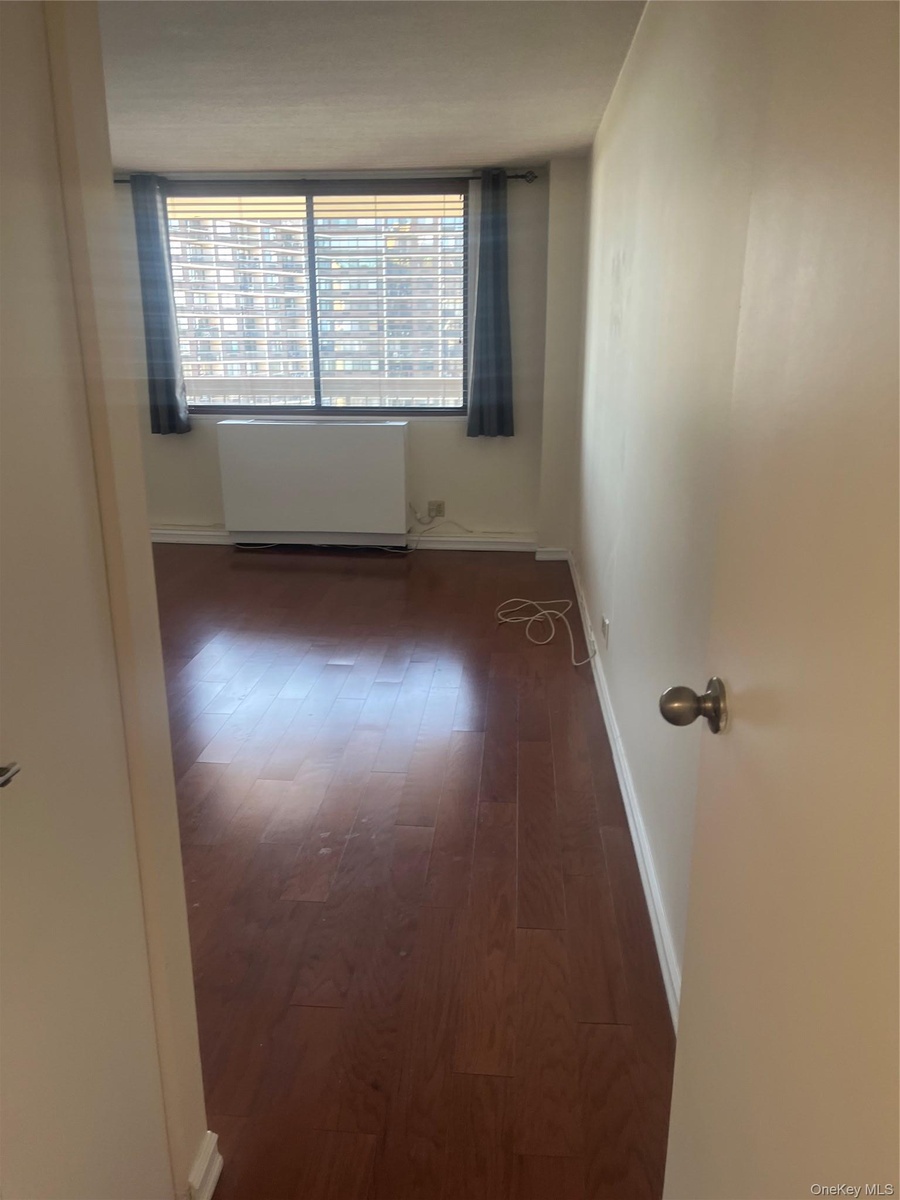 Large bedroom. Wood floors.