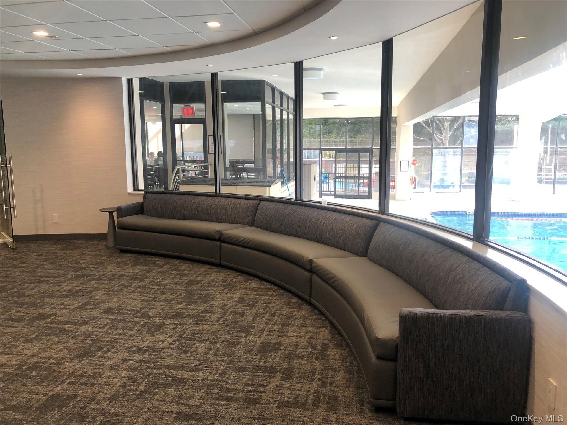 Lounge area overlooking pool in Swim & Fitness center.