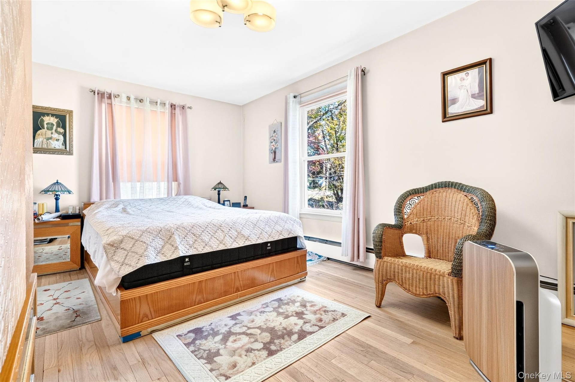 Very Large and Bright Primary Bedroom, featuring Hardwood Flooring and 2 large windows. Located on the 1st floor!