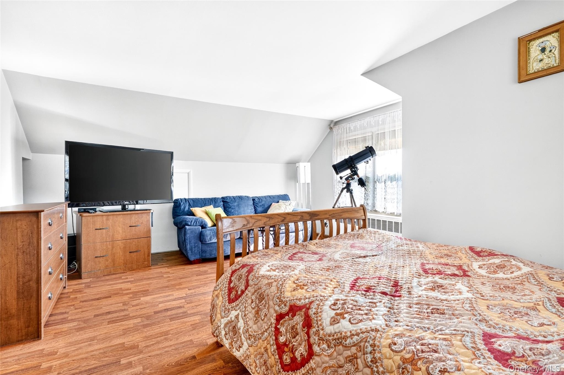 Bright and Sunny 4th Bedroom, located on the 2nd floor. Plenty of space and hardwood flooring!