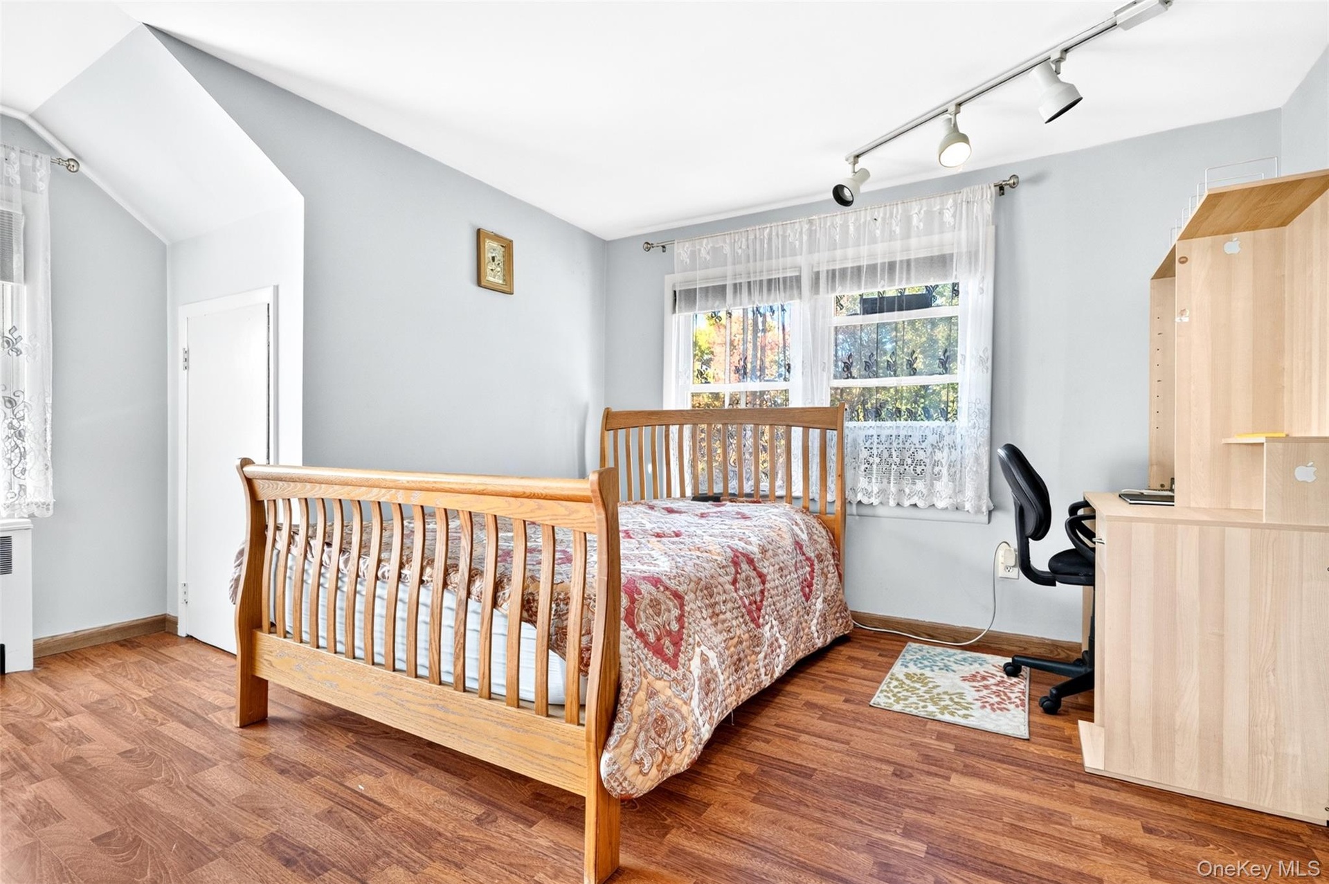 Another view of the extremely bright 3rd Bedroom with hardwood flooring and closets.