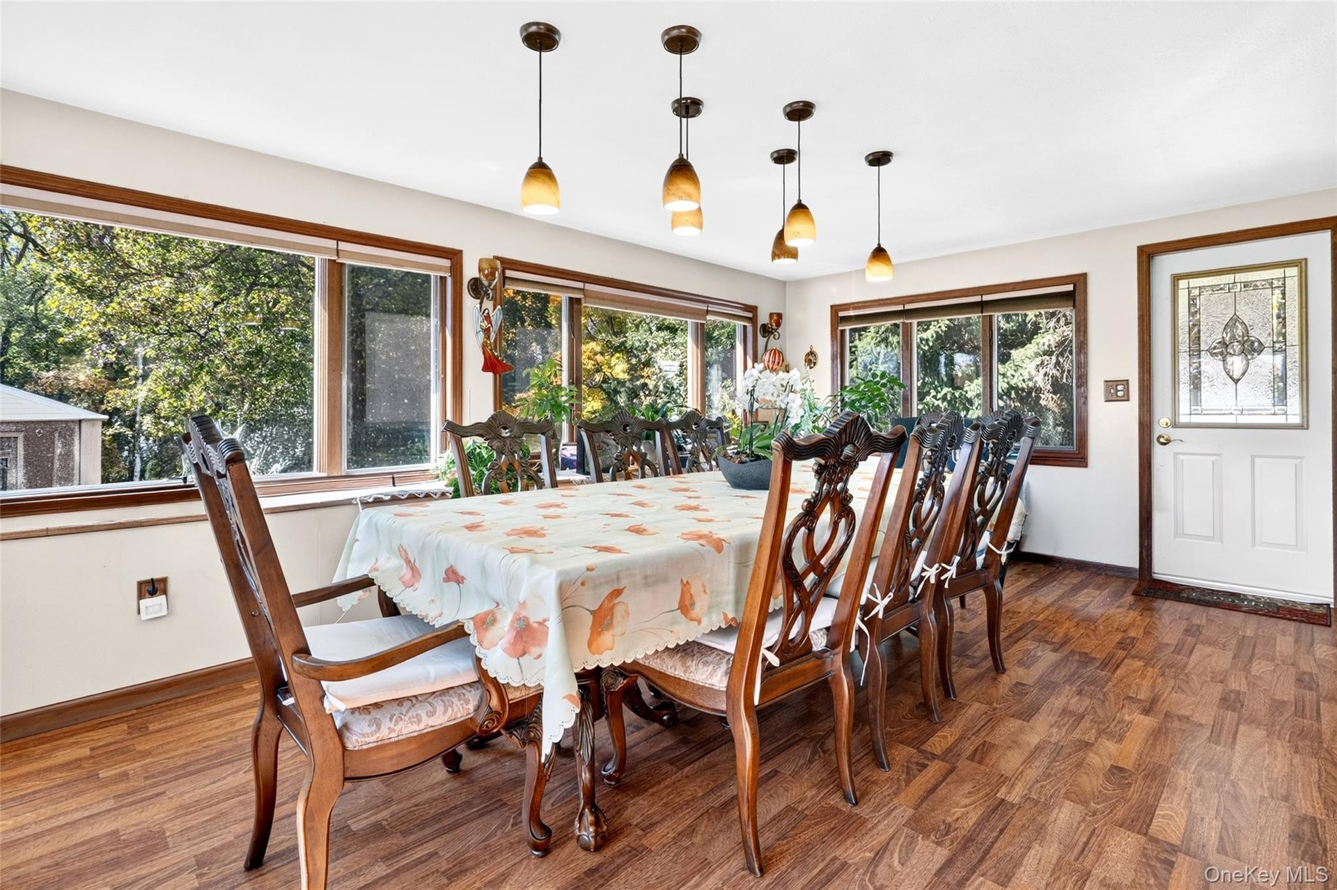 Once you step into this Magnificent and Super Bright Formal Dining Room, boasting lots of oversized Andersen Windows, laminate flooring, cafe' lightin