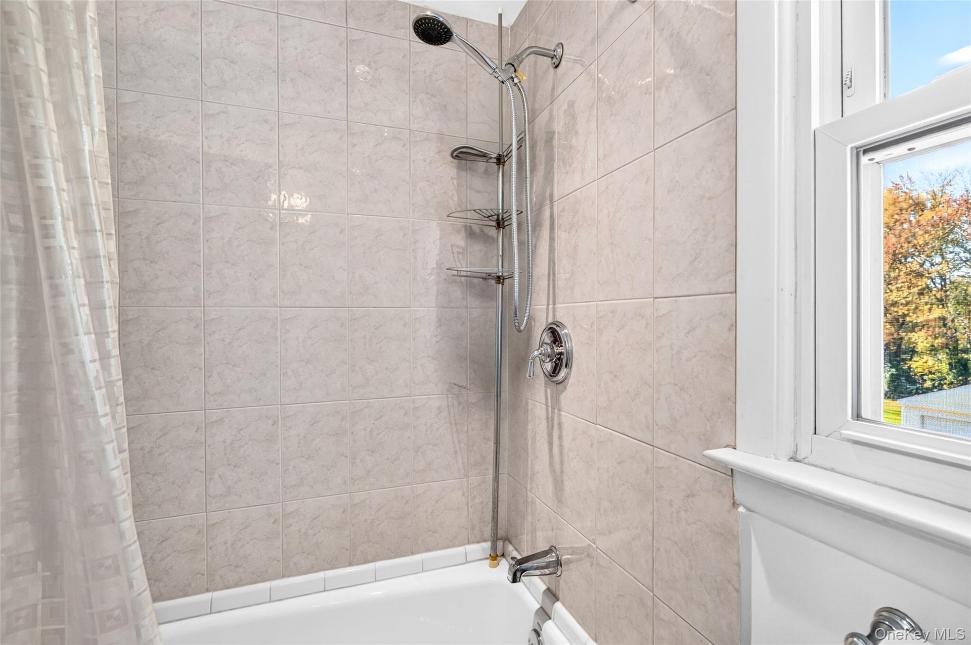 Another view of the 2nd Floor Bathroom, featuring a ceramic tiled bathrub.