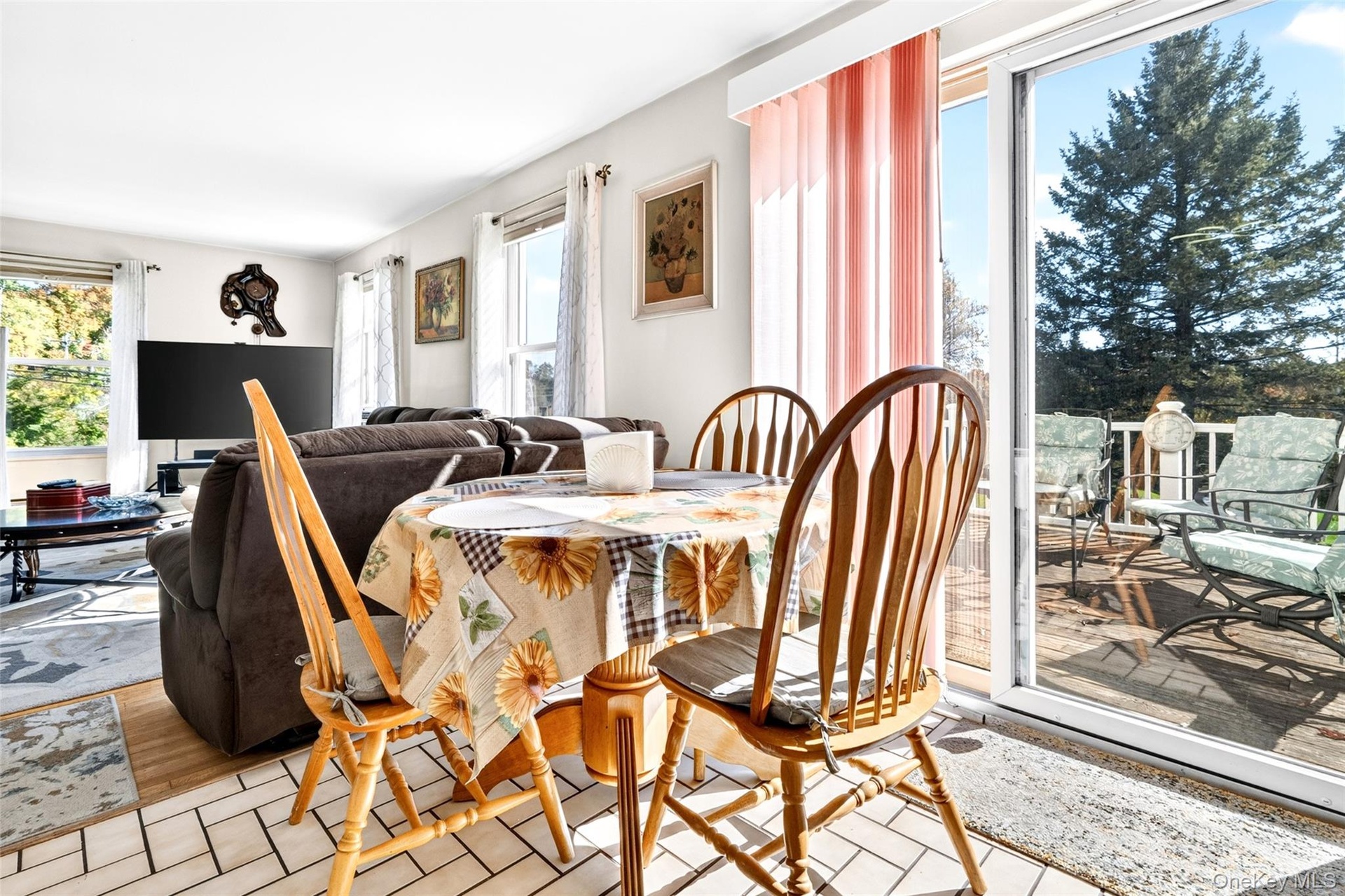 Another view of the Dining Area (Breakfast area) and Glass Sliding Doors to the deck.