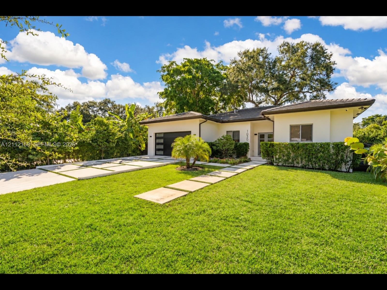 Attached garage, and a walkway to the front entry