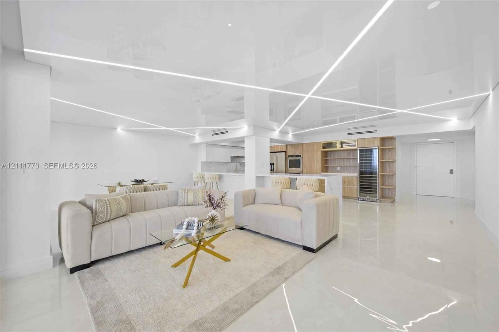 High-gloss, reflective ceiling featuring integrated geometric linear lighting