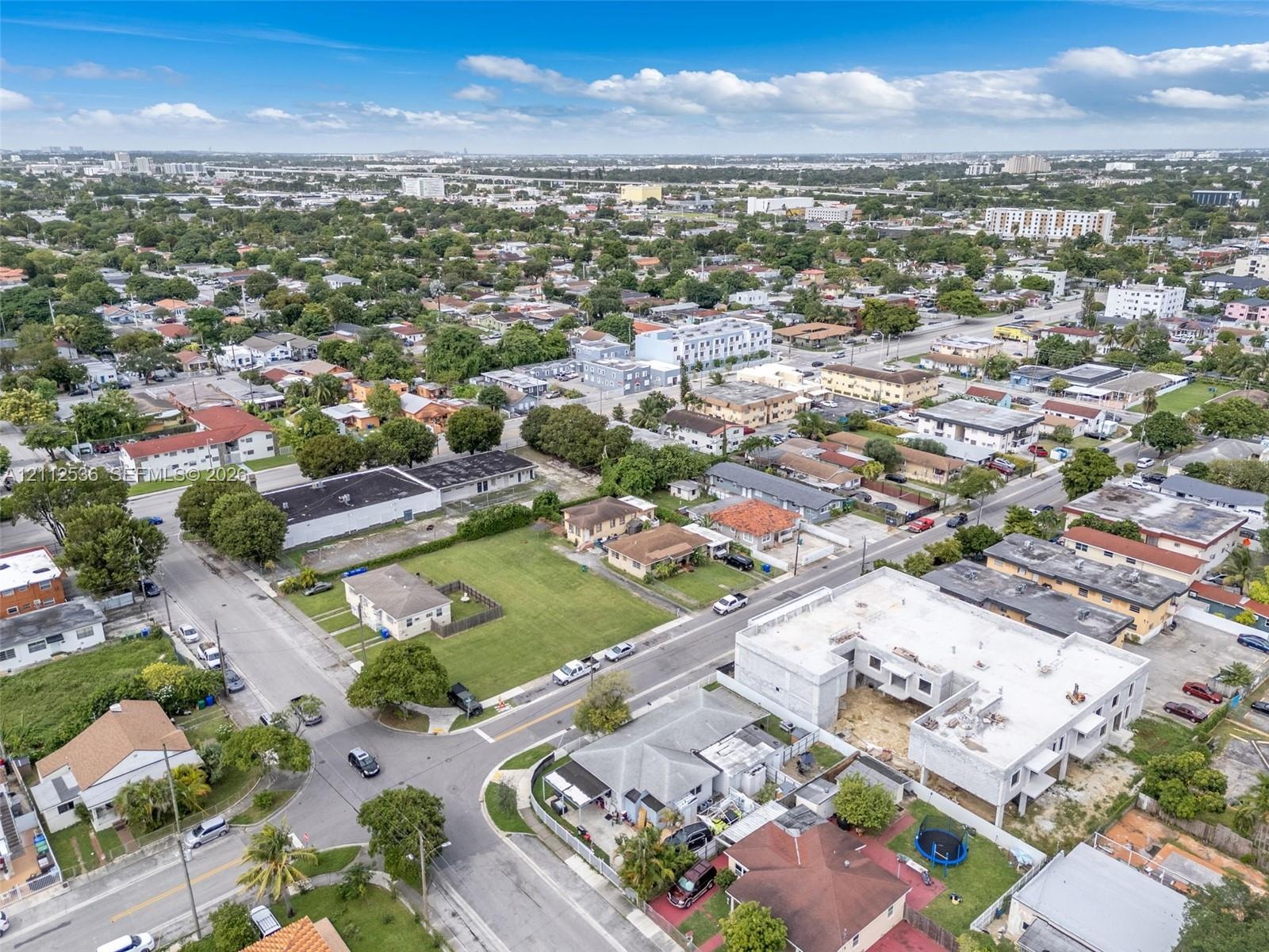 Aerial perspective featuring corner lot positioning and proximity to established residential infrastructure