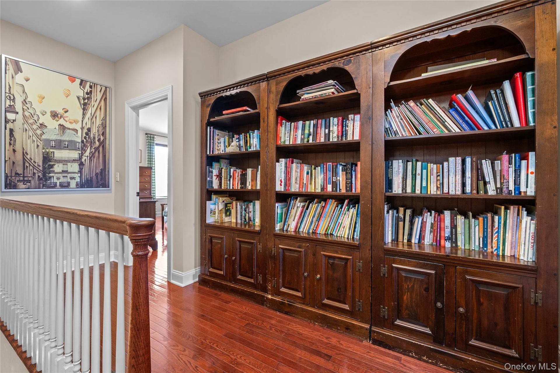 Looking toward the primary bedroom, this hallway recess easily serves as a library.